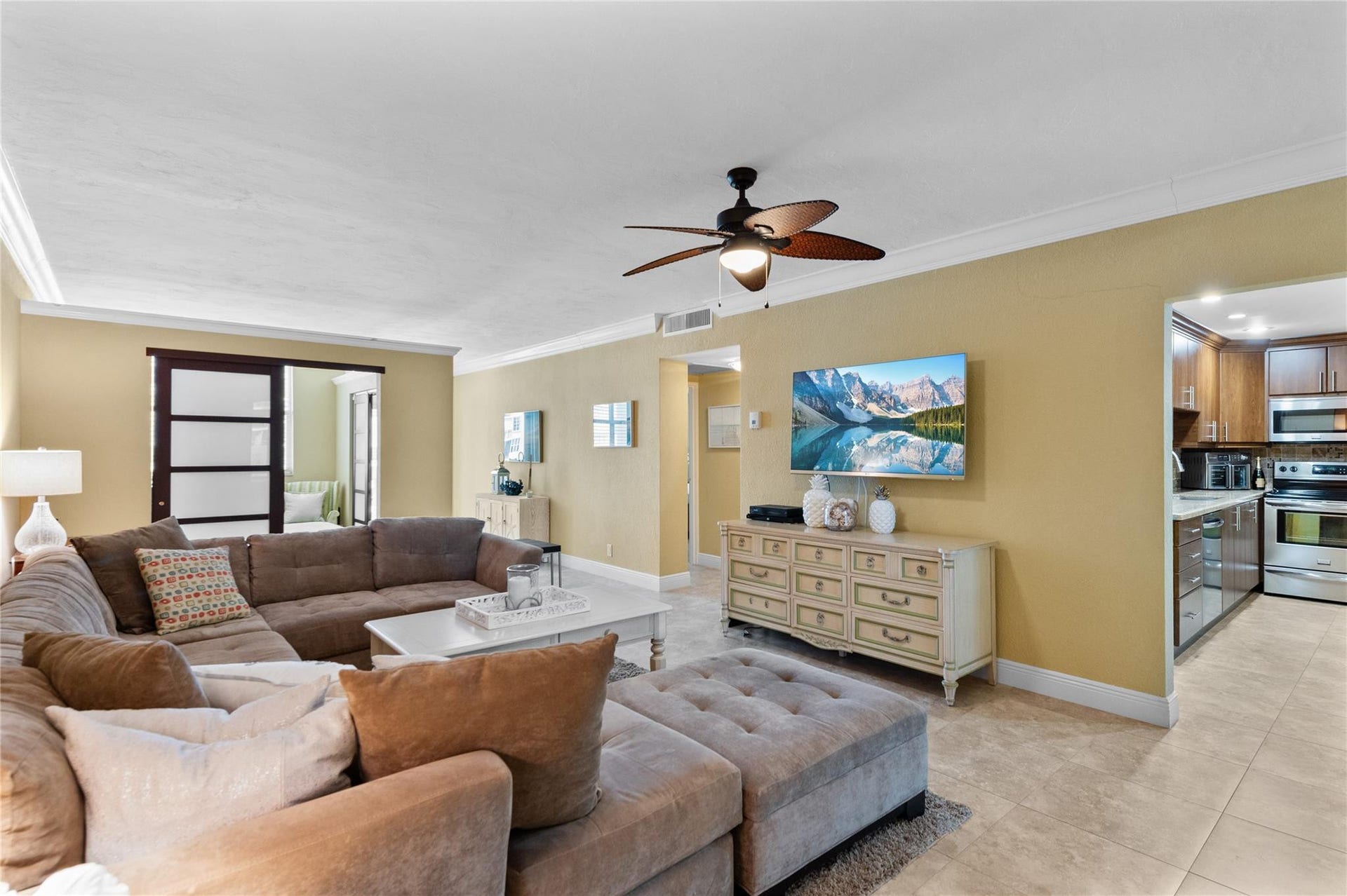 4250 GALT OCEAN Drive, #8L, Fort Lauderdale, Fort Lauderdale, FL 33308 Recessed lighting, crown molding, and a ceiling fan with integrated lighting