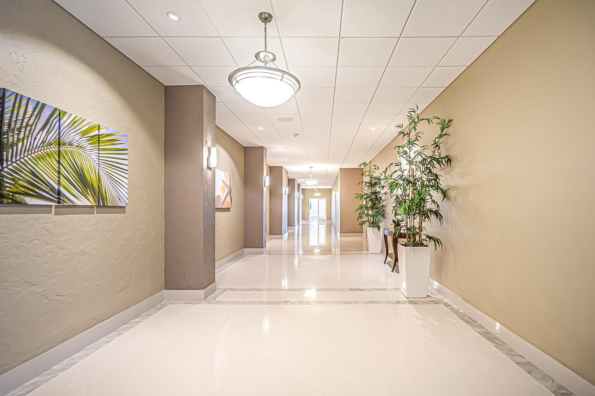 4250 GALT OCEAN Drive, #8L, Fort Lauderdale, Fort Lauderdale, FL 33308 Hallway featuring polished tile flooring, recessed lighting, and decorative wall sconces