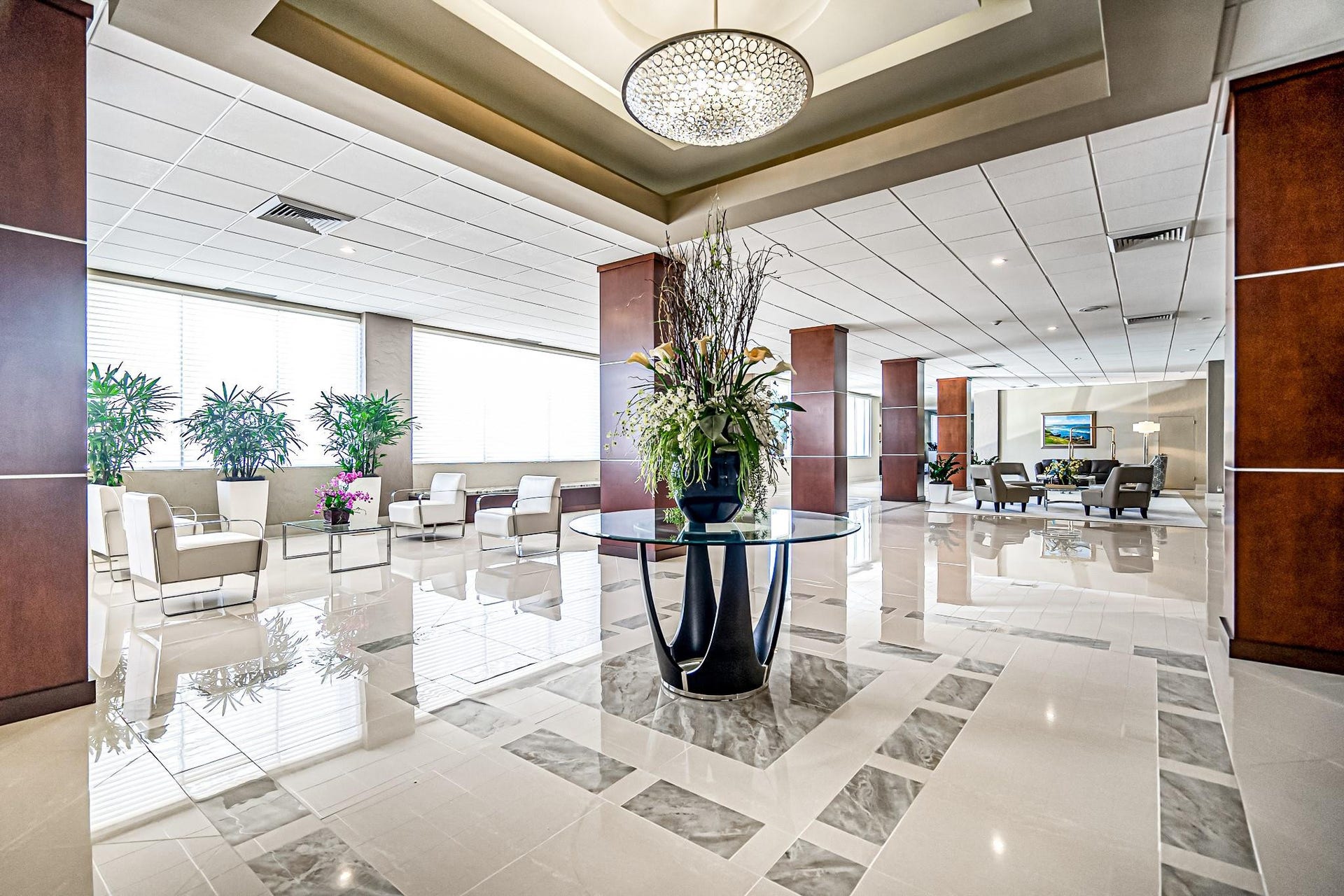 4250 GALT OCEAN Drive, #8L, Fort Lauderdale, Fort Lauderdale, FL 33308 Expansive lobby featuring polished tile flooring with decorative inlay, contemporary chandelier, and large windows