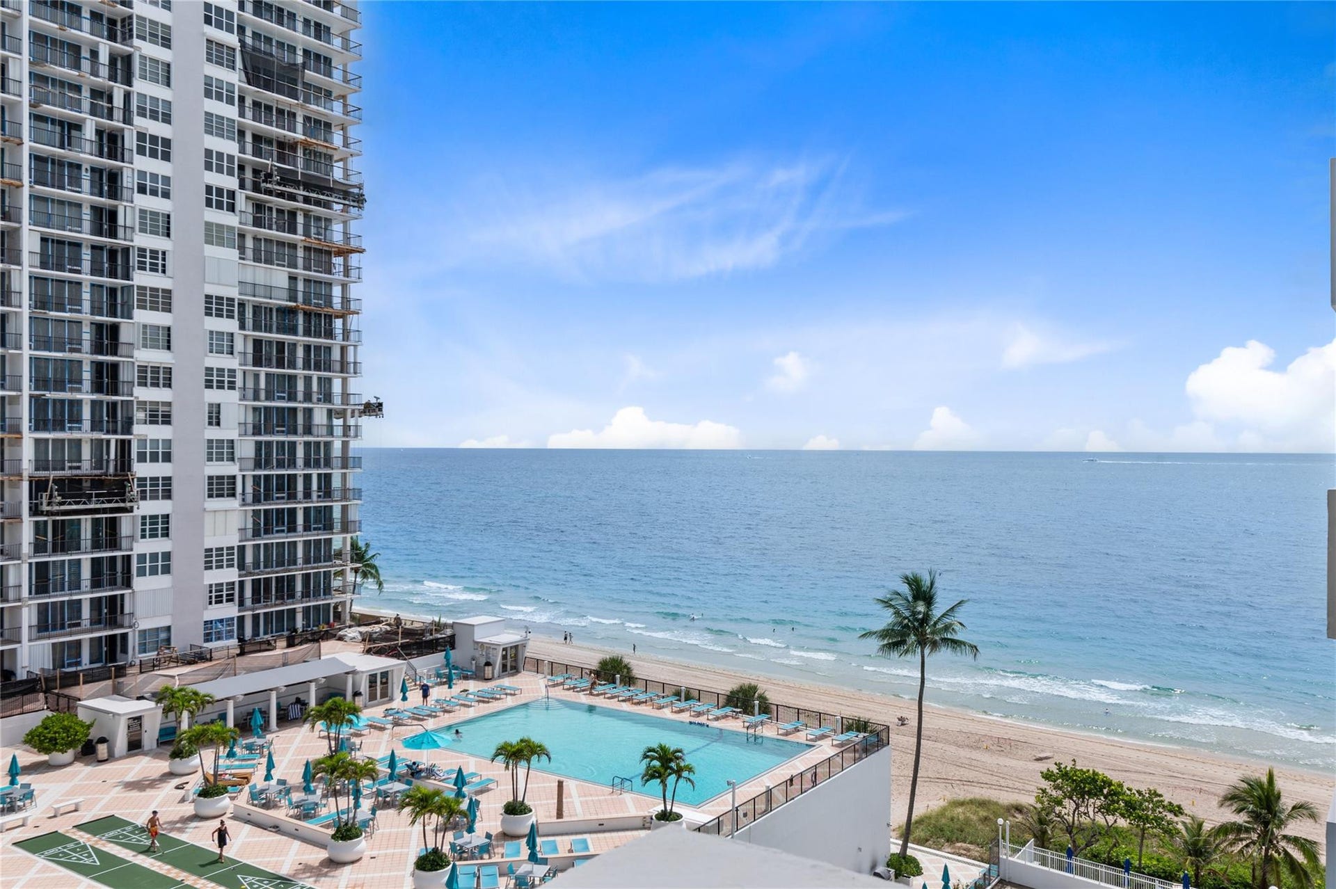 4250 GALT OCEAN Drive, #8L, Fort Lauderdale, Fort Lauderdale, FL 33308 Expansive oceanfront setting featuring a resort-style pool, sandy beach, and tropical landscaping