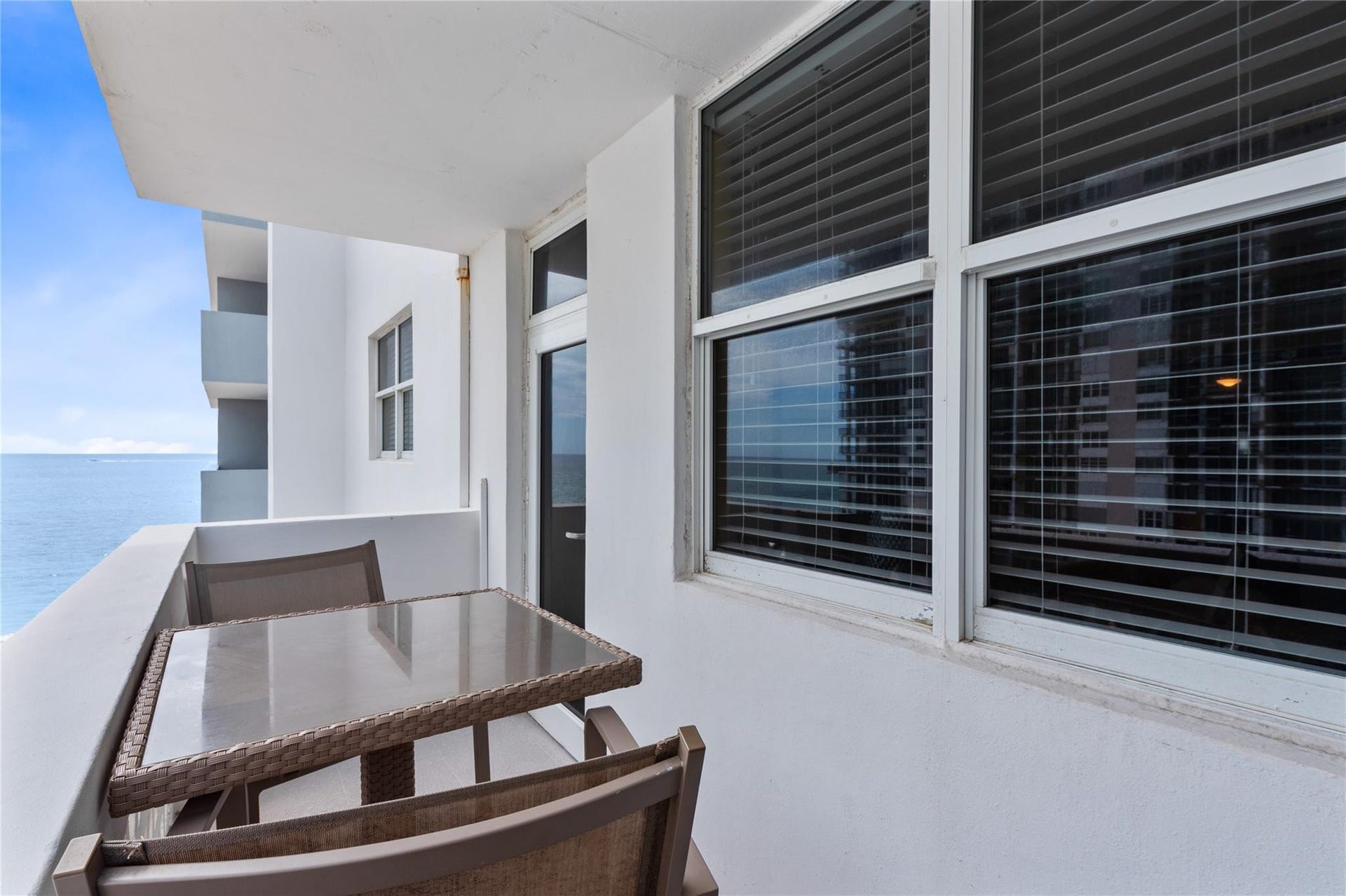 4250 GALT OCEAN Drive, #8L, Fort Lauderdale, Fort Lauderdale, FL 33308 Private outdoor balcony featuring a painted concrete railing and a scenic water backdrop