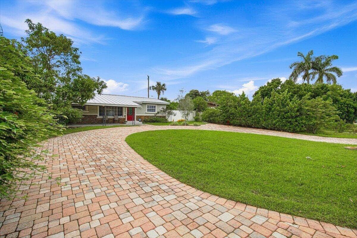 938 Arlington Drive, West Palm Beach, FL 33415 02-Front Home-B