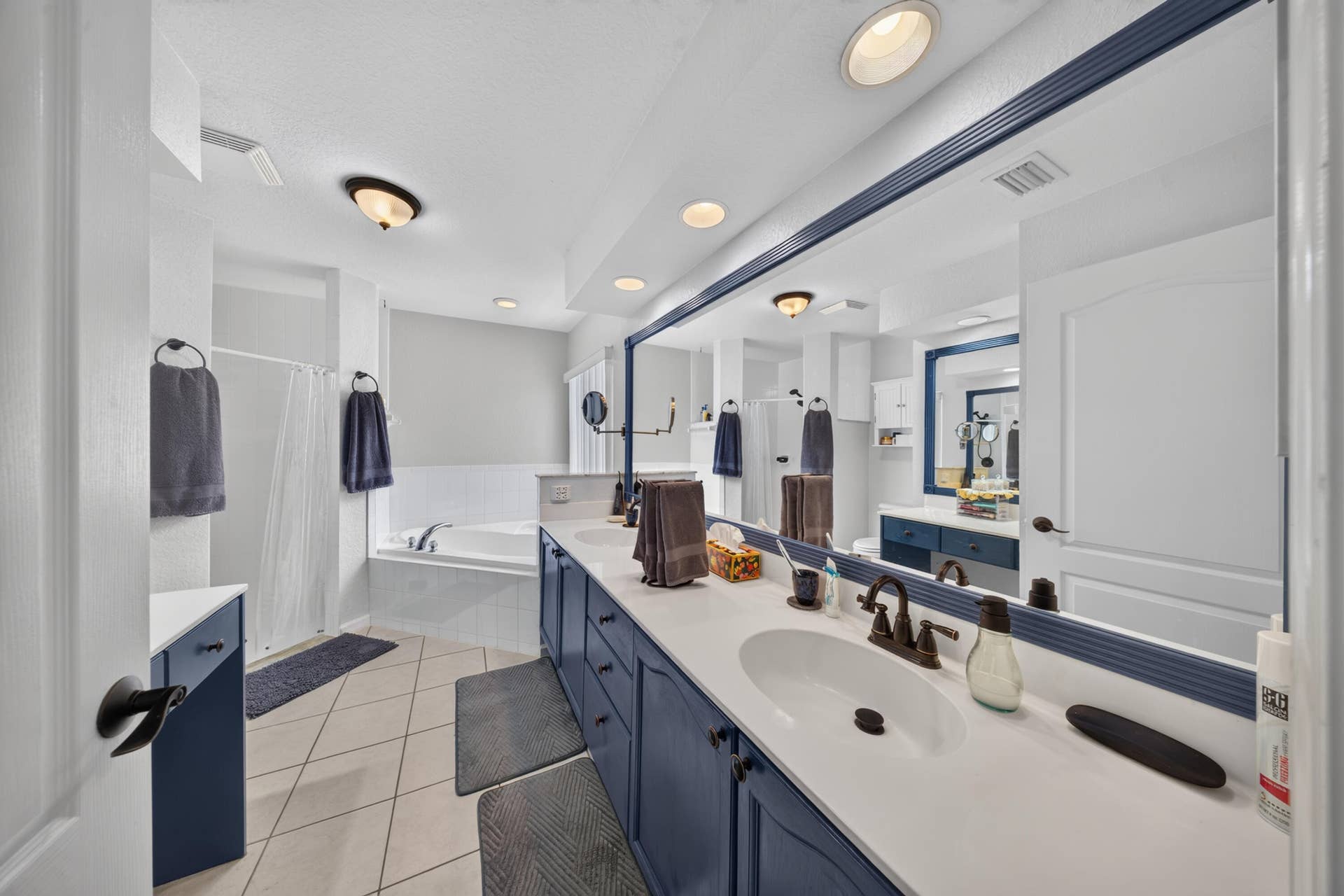 3274 SW CRUMPACKER Street, Port St Lucie, FL 34953 Dual vanity with white countertops and dark cabinetry