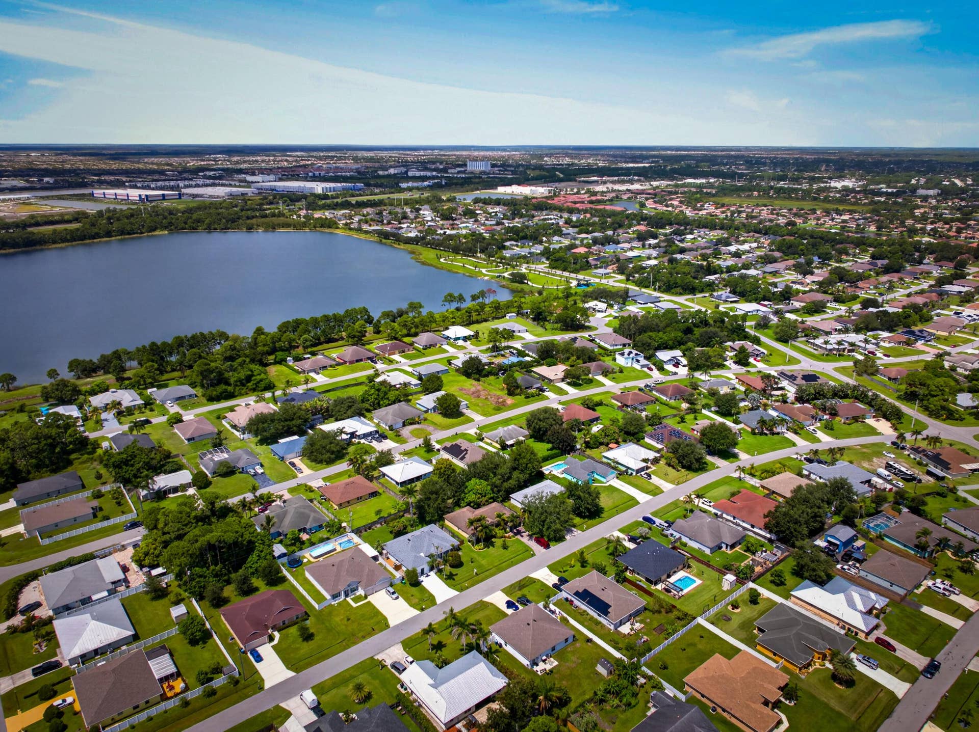 3274 SW CRUMPACKER Street, Port St Lucie, FL 34953 Aerial perspective showcasing a residential area with varied housing styles