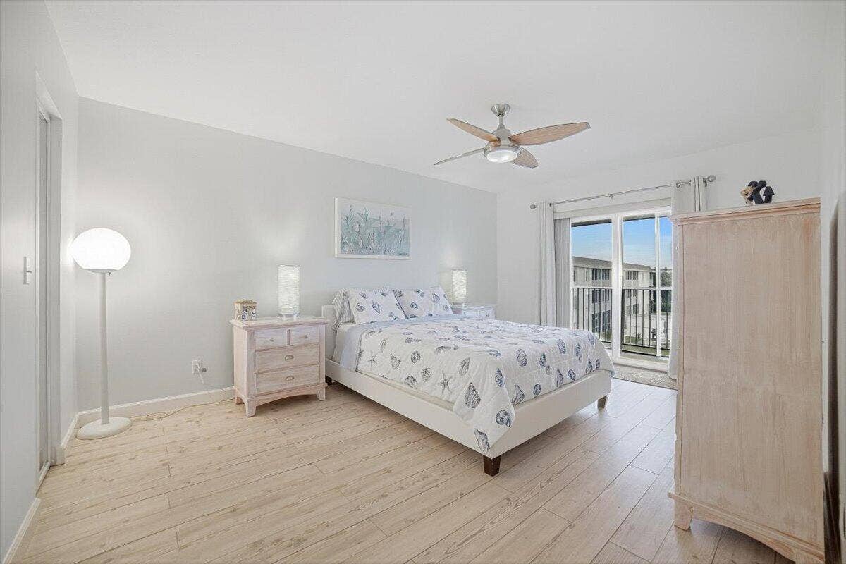 131 Doolen Court, #309, North Palm Beach, FL 33408 Master Bedroom with Slider to Balcony
