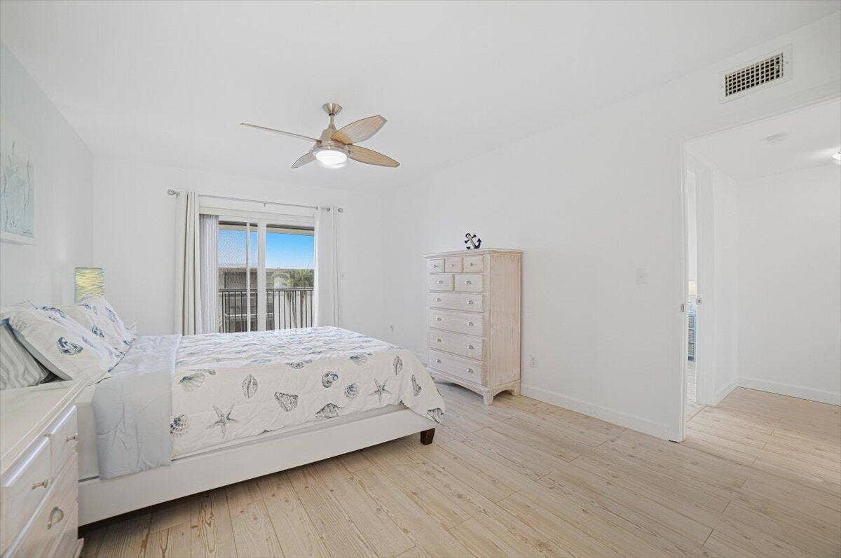 131 Doolen Court, #309, North Palm Beach, FL 33408 Master Bedroom with Slider