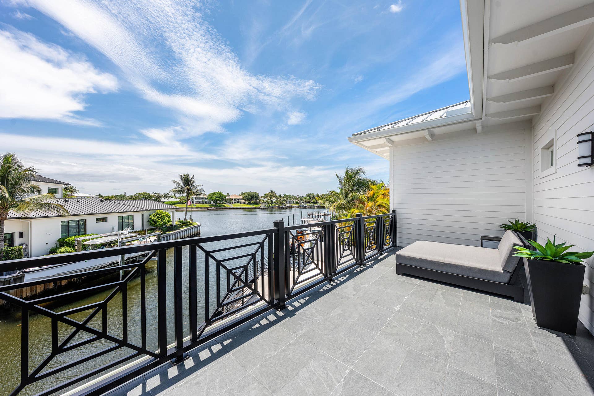 12898 S Shore Drive, Palm Beach Gardens, FL 33410 Large waterfront balcony with picturesque views.