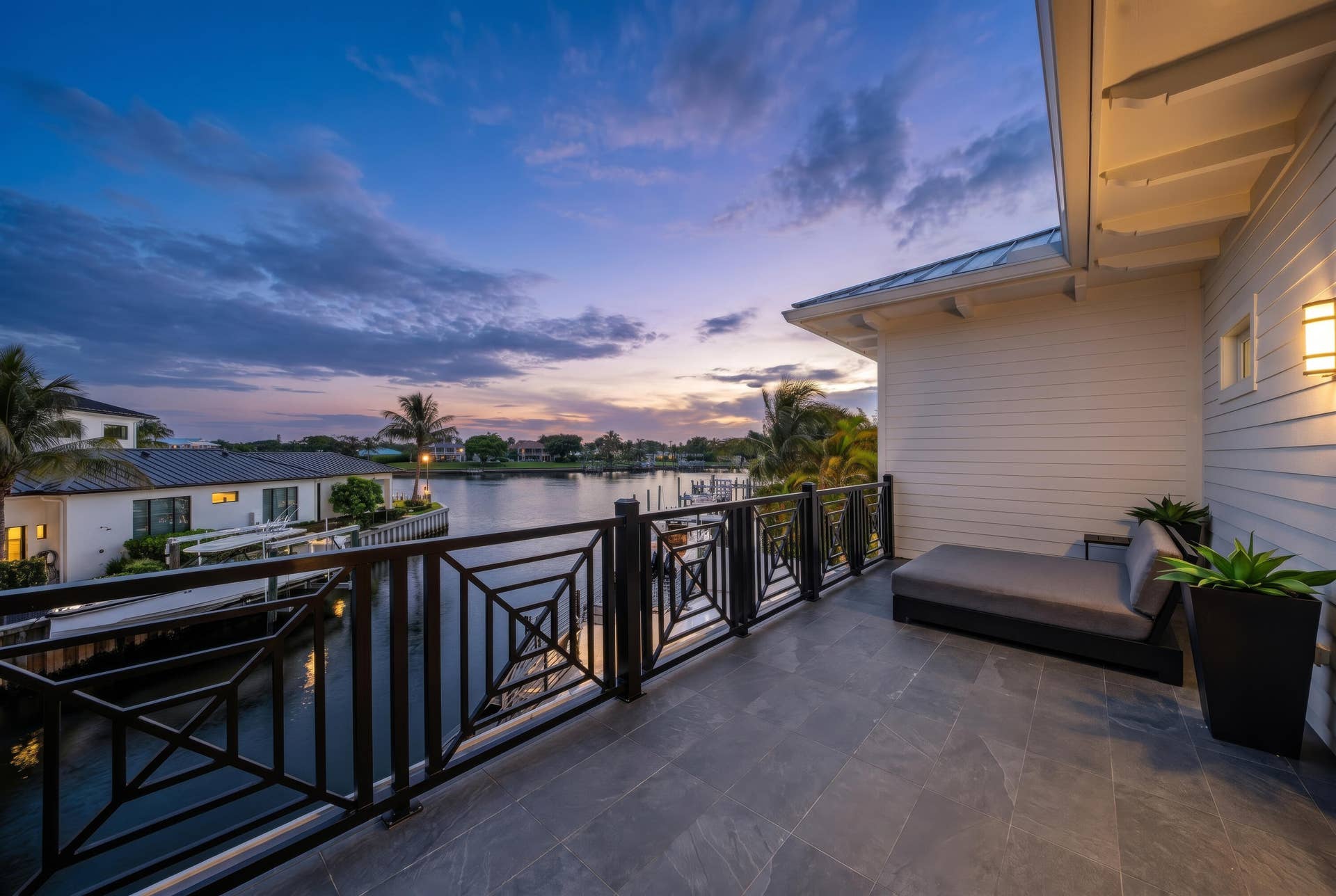 12898 S Shore Drive, Palm Beach Gardens, FL 33410 Large waterfront balcony with picturesque views.