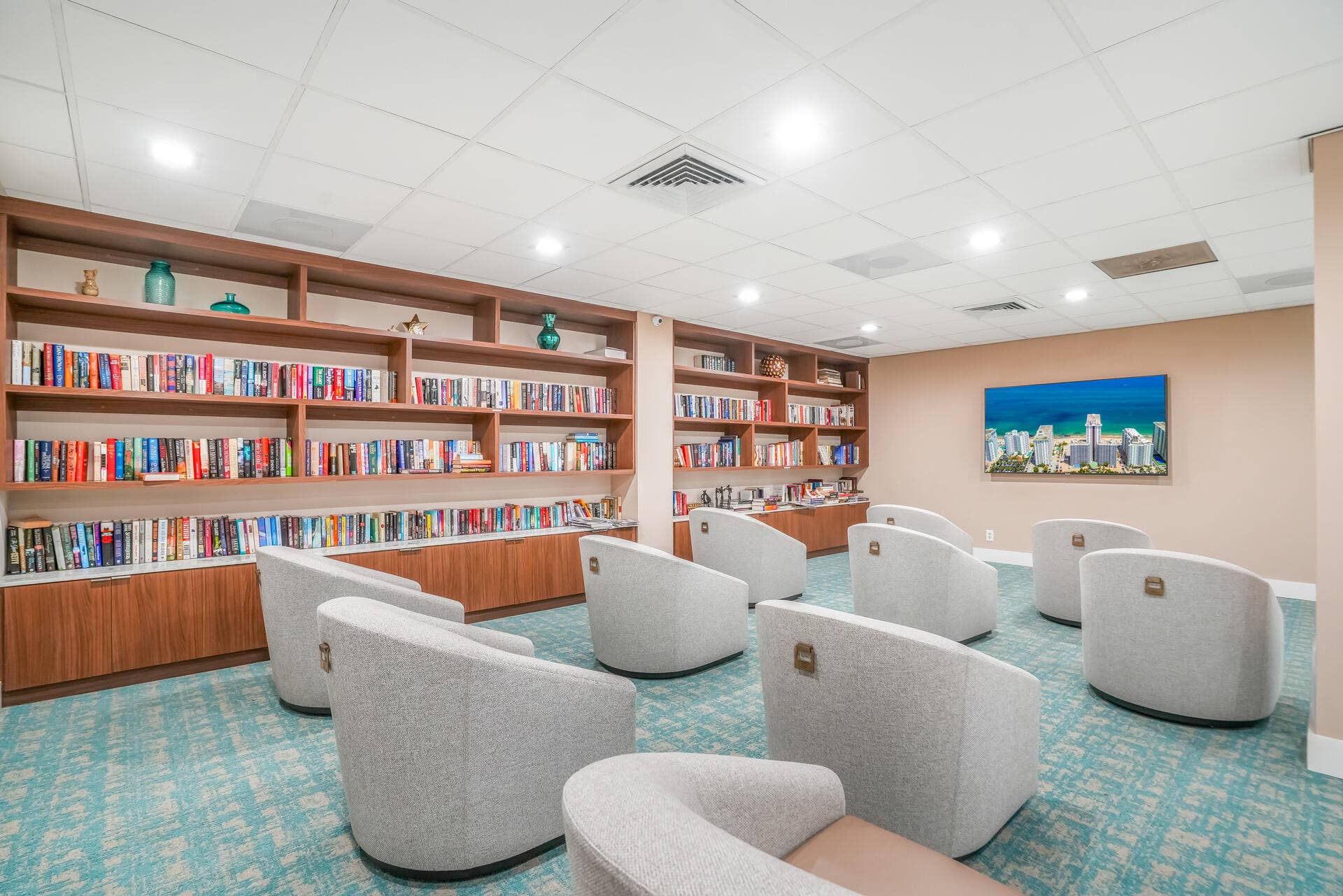 3500 Galt Ocean Drive, #807, Fort Lauderdale, FL 33308 Built-in shelving with integrated cabinetry, recessed lighting, and patterned carpeting
