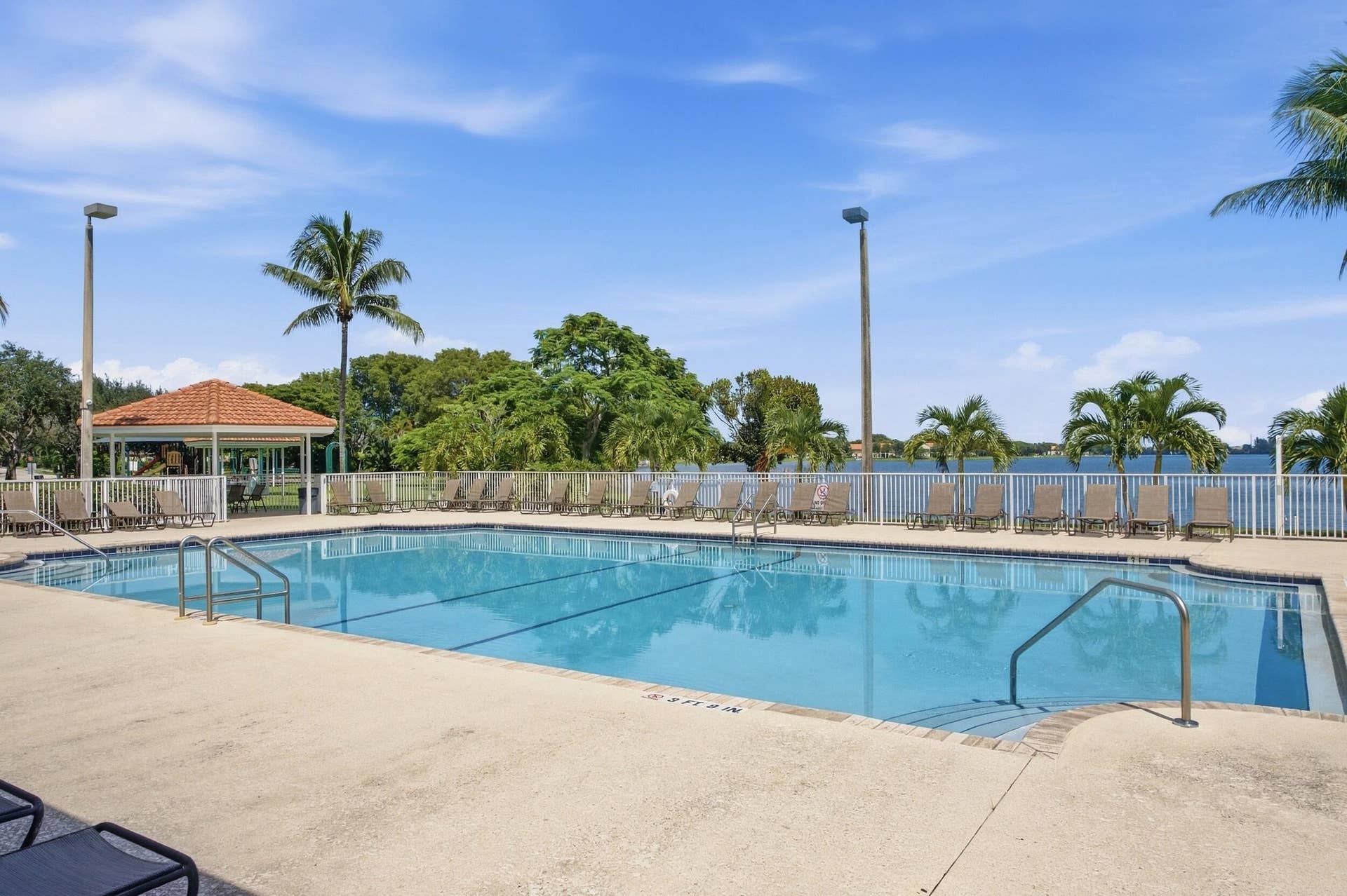 Beautifully landscaped gated Homeowners Association. Our community offers two swimming pools and playgrounds, a tennis court, basketball court, exercise room, barbeque areas, lake, and clubhouse.