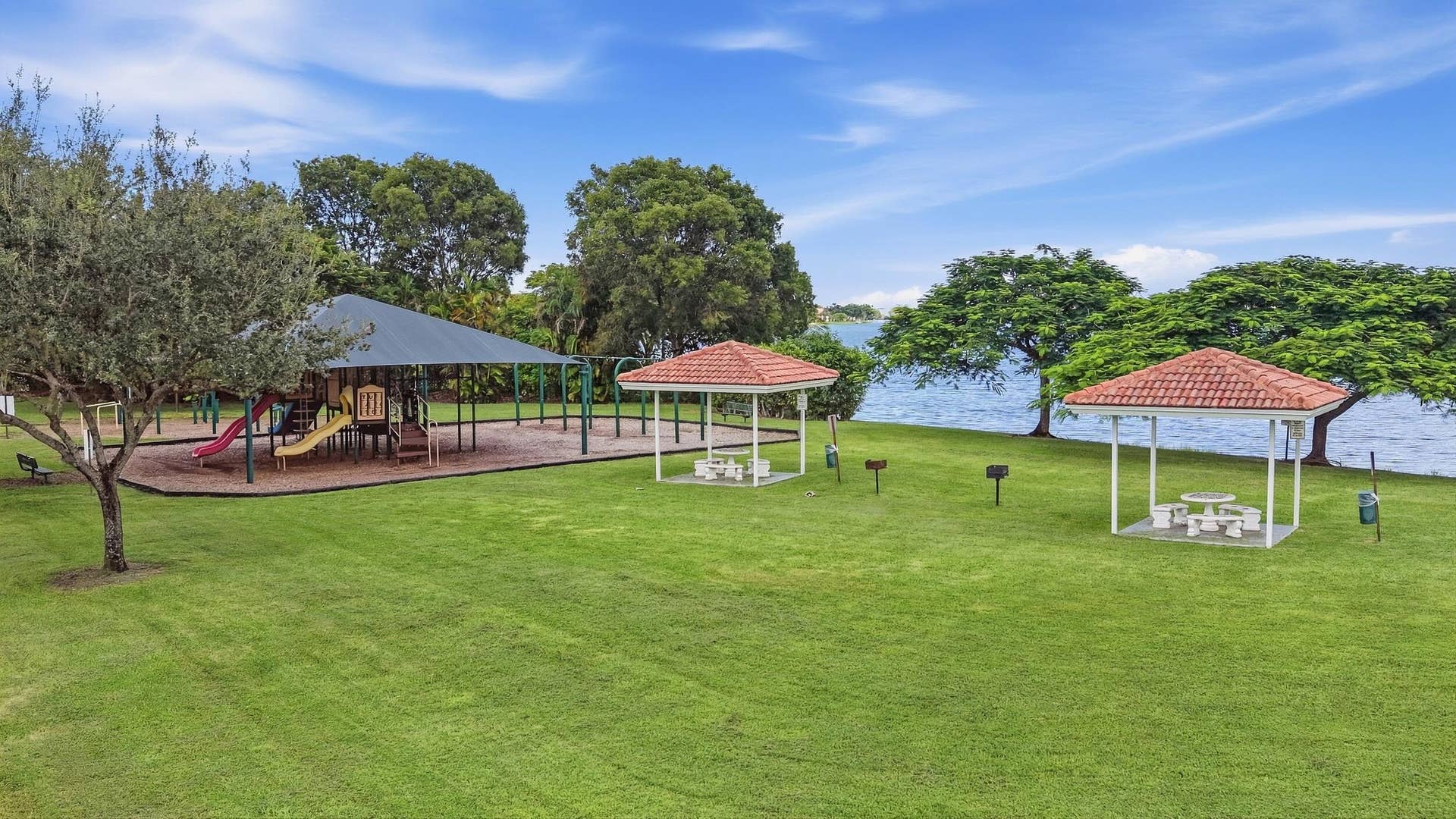 Beautifully landscaped gated Homeowners Association. Our community offers two swimming pools and playgrounds, a tennis court, basketball court, exercise room, barbeque areas, lake, and clubhouse.