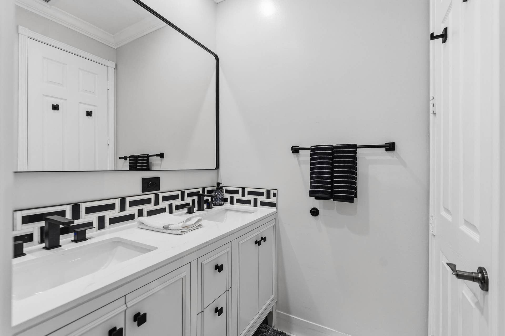 Updated dual vanity provides generous counter space and a clean, modern look.