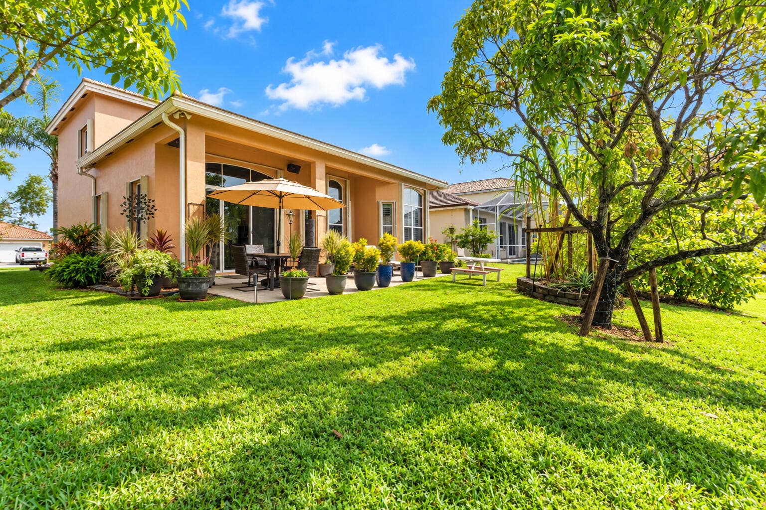 Covered patio offers a comfortable setting for outdoor dining and entertaining with lake views.