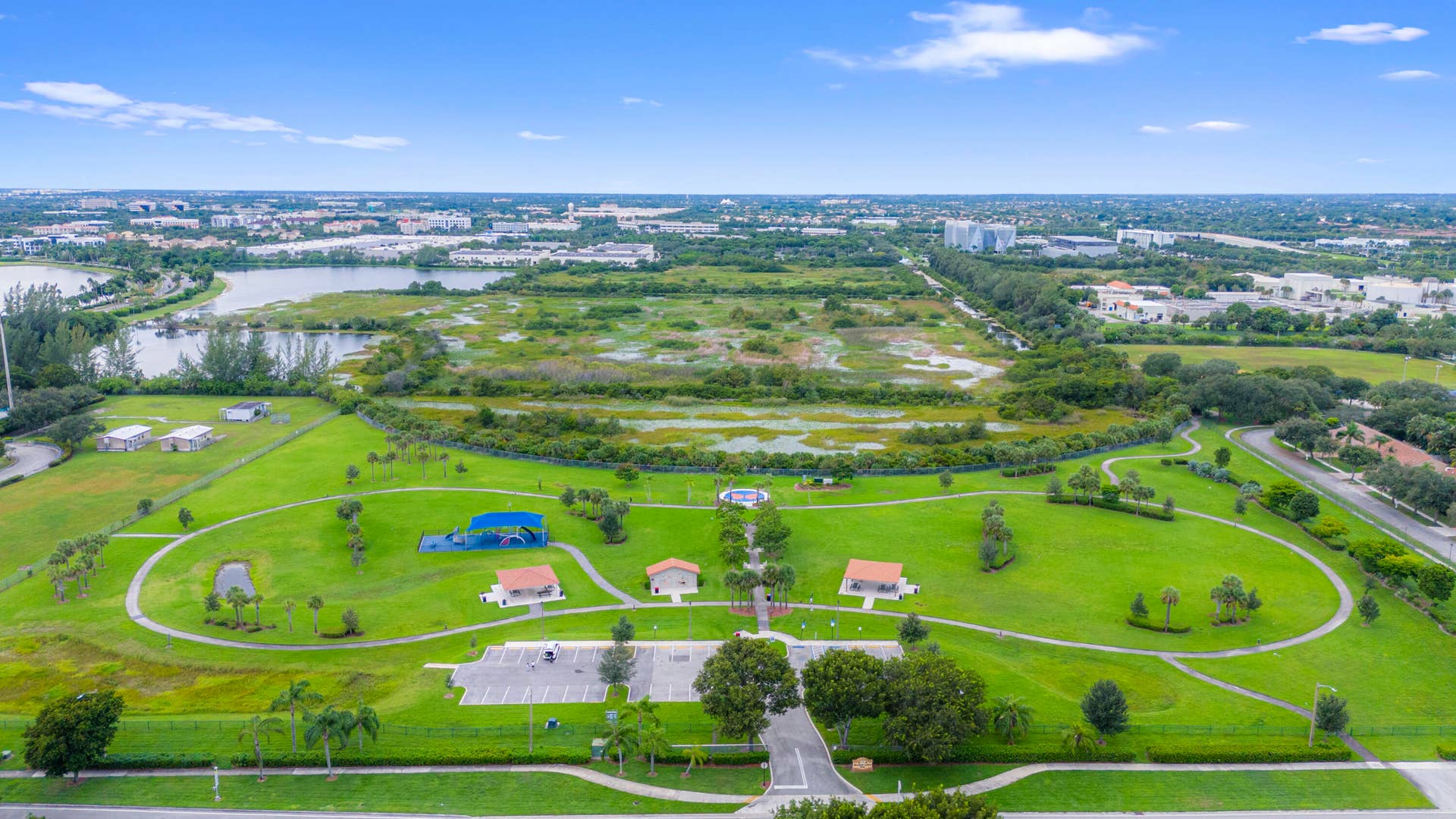 Monarch Lakes neighborhood park featuring expansive lush greenery throughout the community.