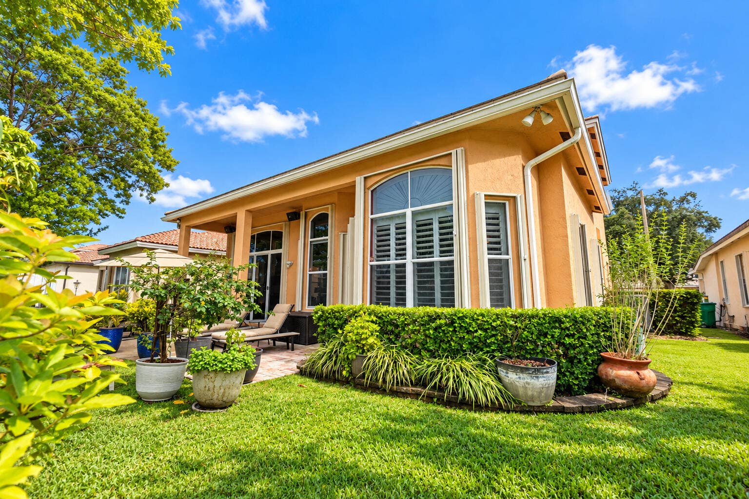 Picturesque waterfront surroundings with beautifully maintained green space.