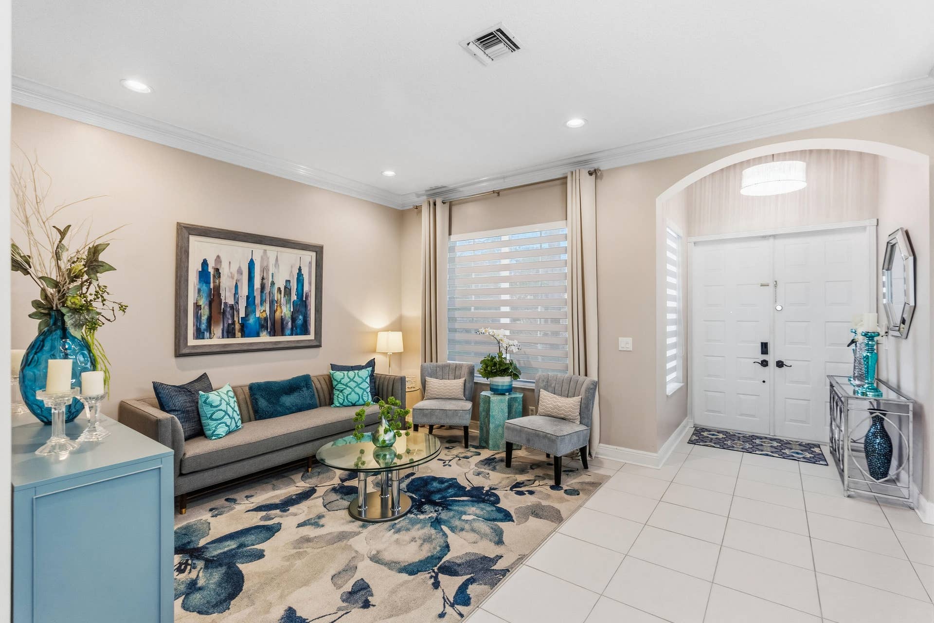 Bright living room offers a comfortable gathering space just off the homes entry.
