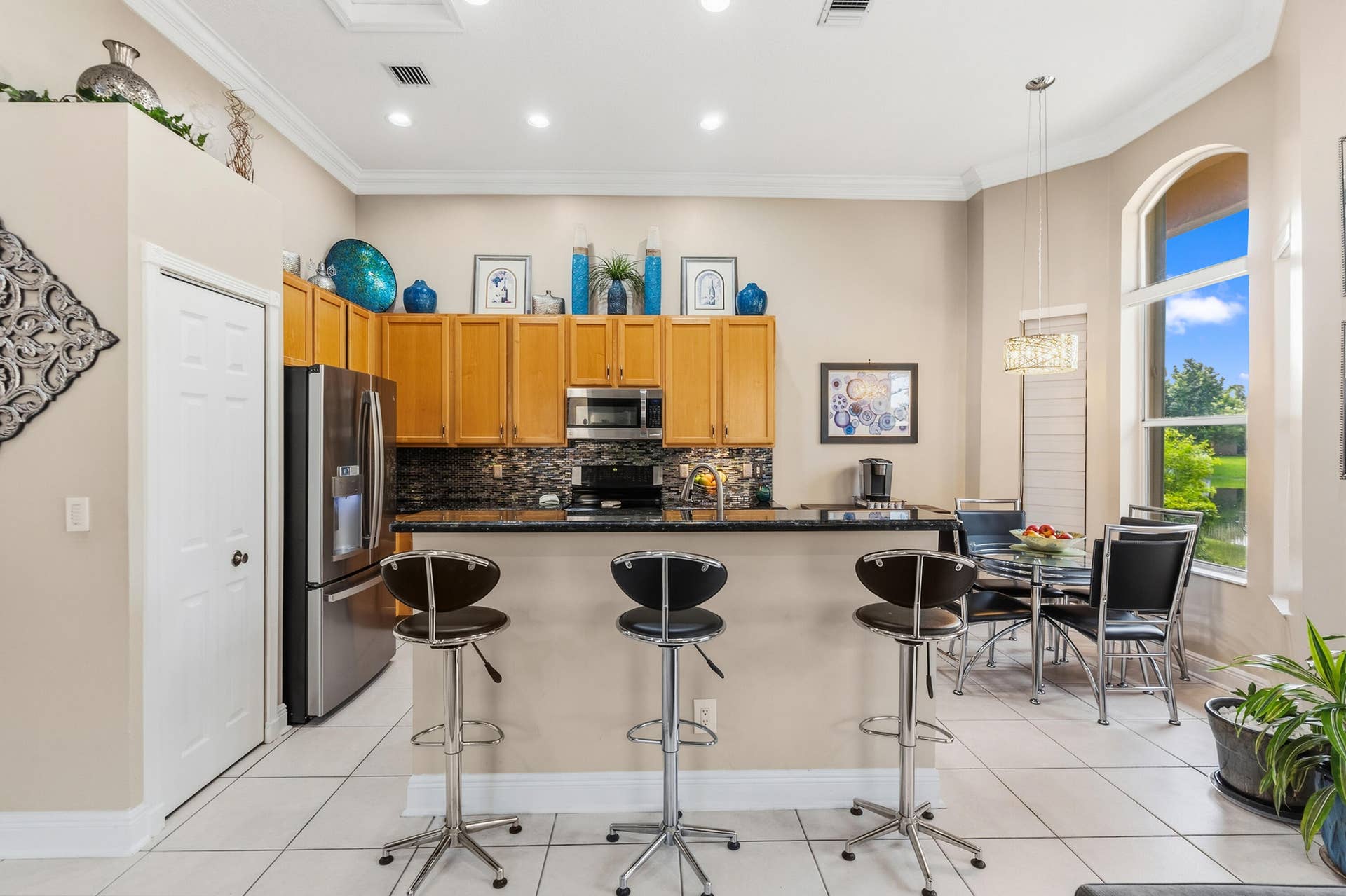 Open connection between the kitchen and family room creates an easy flow for everyday living.