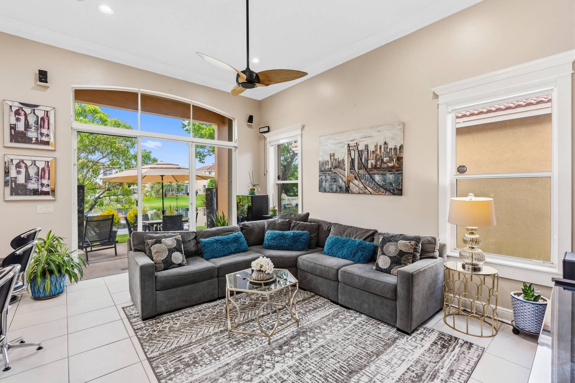 Volume ceilings and expansive windows fill the family room with natural light and lake views.