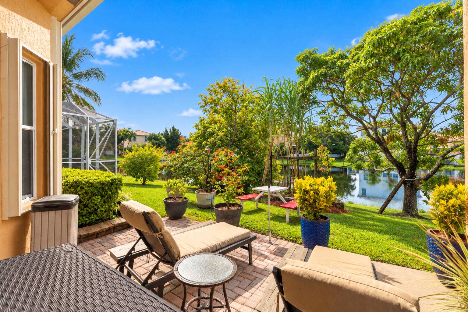 Additional patio space provides the perfect spot to unwind and take in the surrounding greenery.