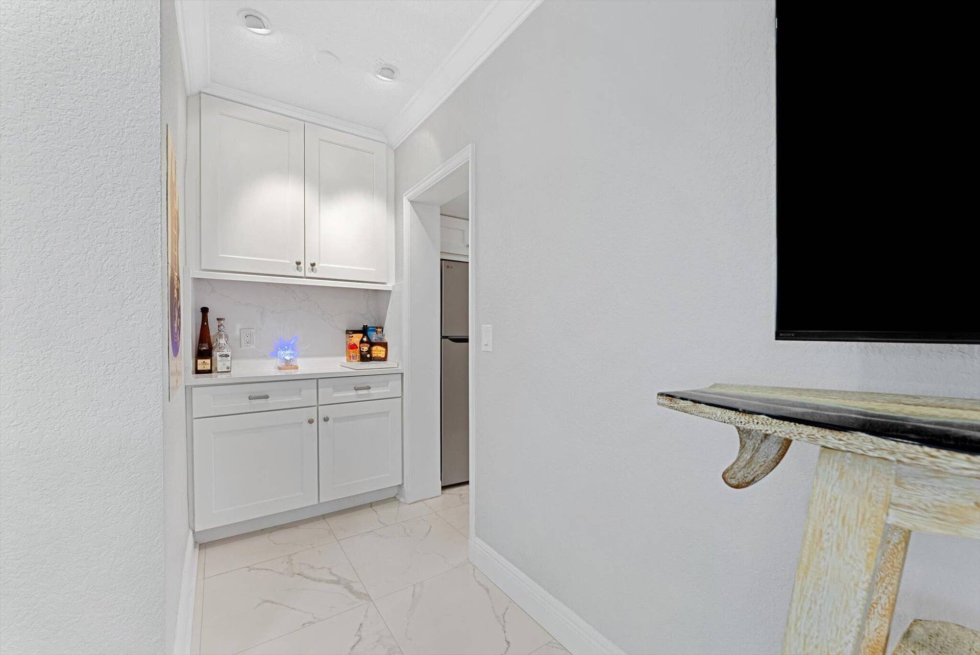 990 CASUARINA Road, #4, Delray Beach, FL 33483 Built-in bar and storage unit.