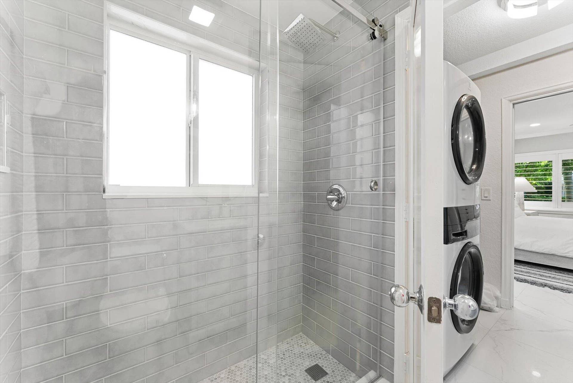 990 CASUARINA Road, #4, Delray Beach, FL 33483 Beautifully renovated bathroom with modern finishes.