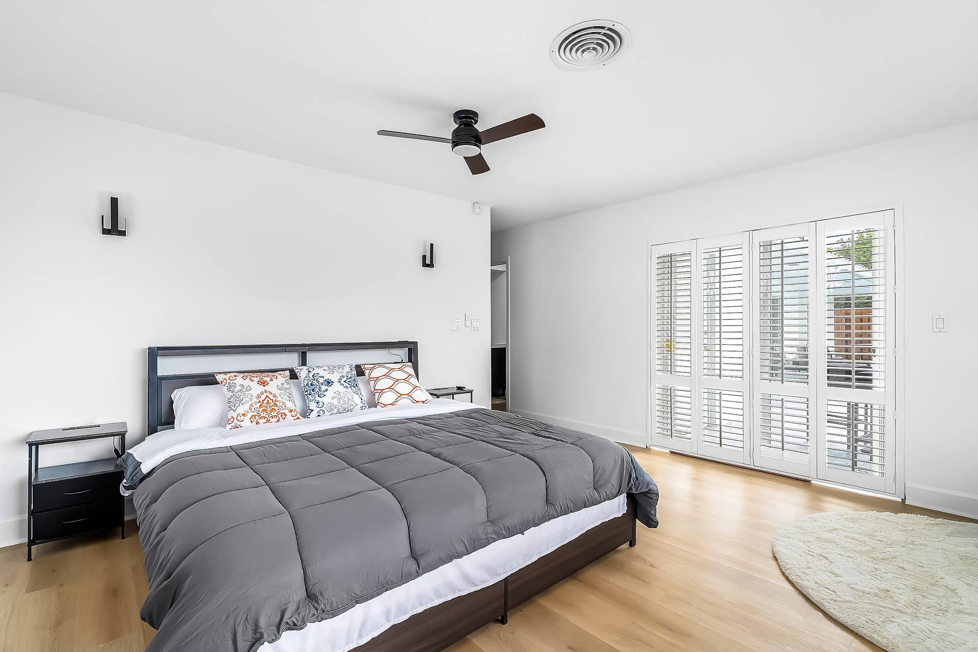 1250 SE 10TH Street, Deerfield Beach, Deerfield Beach, FL 33441 Bedroom featuring light wood-finish flooring and white walls