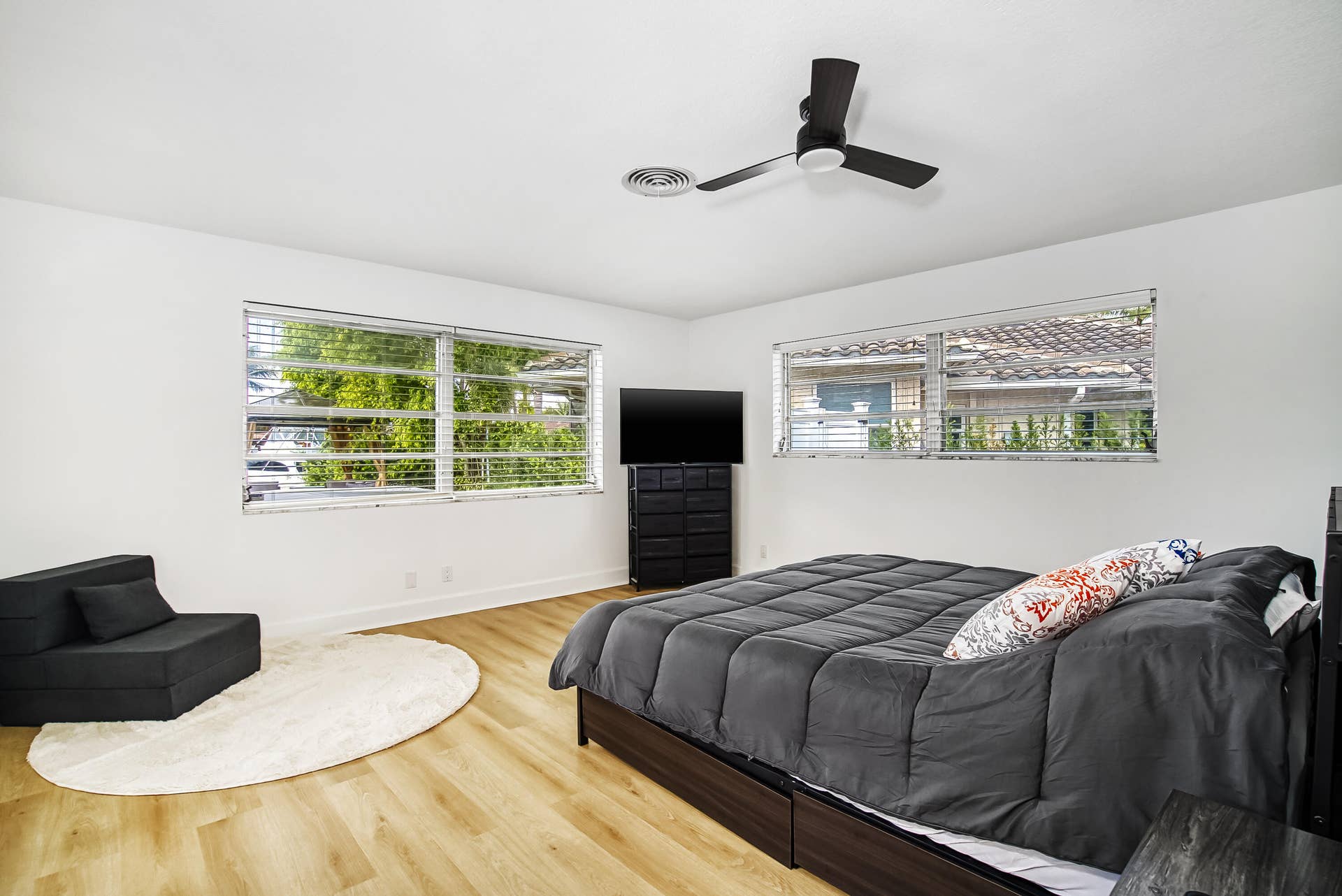 1250 SE 10TH Street, Deerfield Beach, Deerfield Beach, FL 33441 Spacious room featuring light wood-finish flooring, white walls, and a contemporary ceiling fan