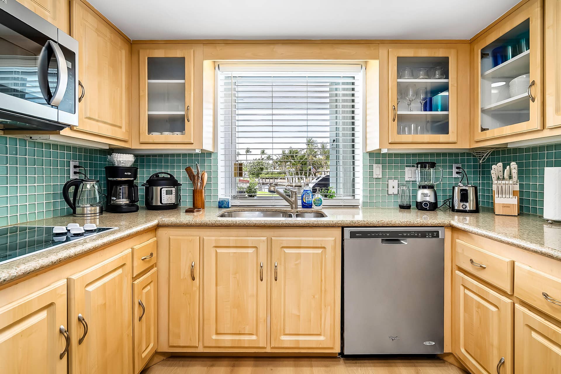 1250 SE 10TH Street, Deerfield Beach, Deerfield Beach, FL 33441 Kitchen featuring light wood cabinetry, a tiled backsplash, and stone-finish countertops