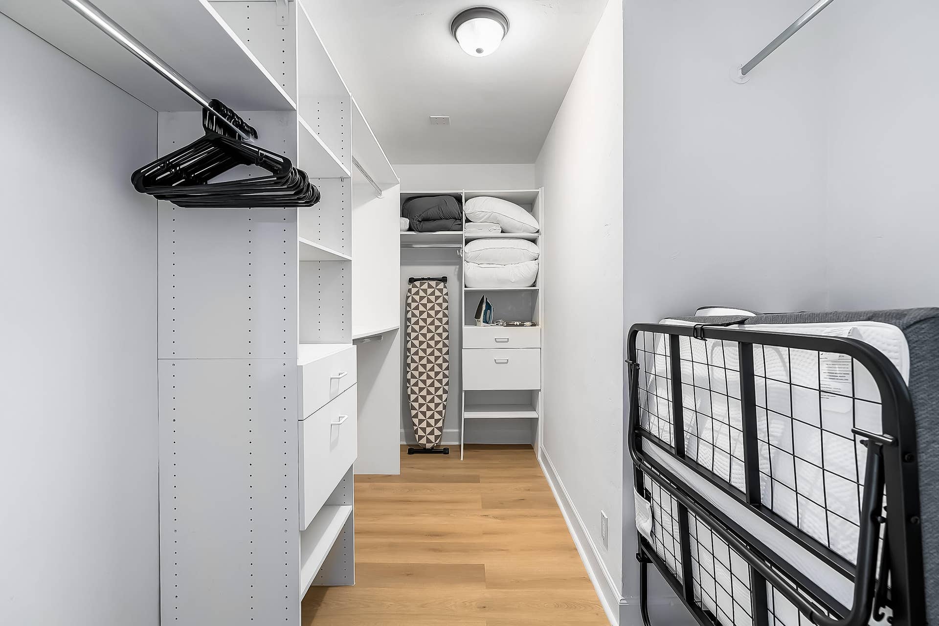 1250 SE 10TH Street, Deerfield Beach, Deerfield Beach, FL 33441 Custom closet system featuring white shelving, integrated drawers, and hanging rods