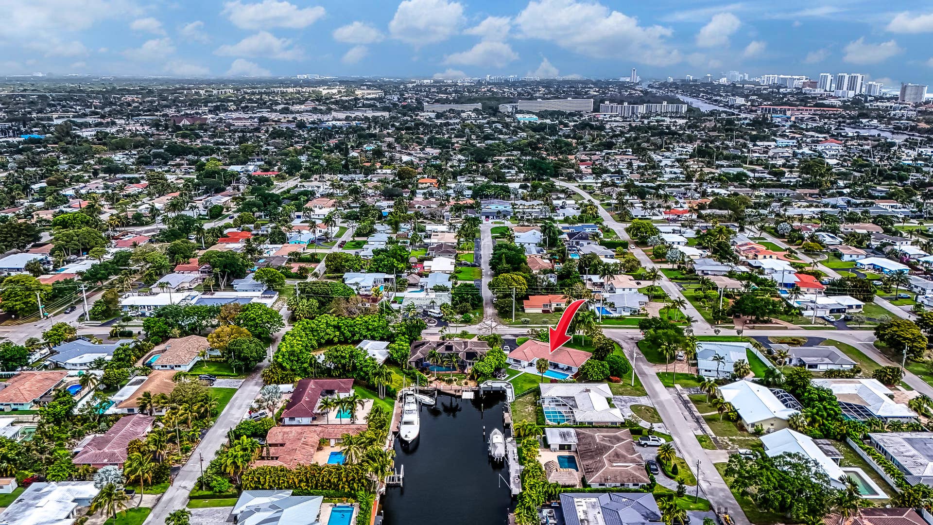 1250 SE 10TH Street, Deerfield Beach, Deerfield Beach, FL 33441 Waterfront property featuring a private boat dock, mature landscaping, and a swimming pool