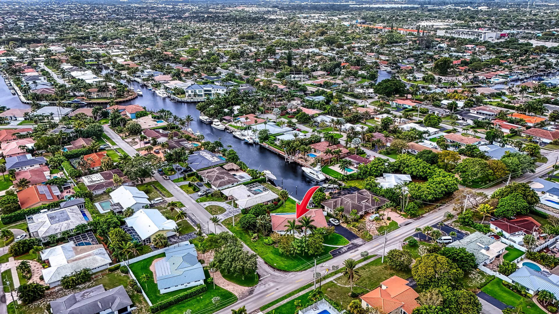 1250 SE 10TH Street, Deerfield Beach, Deerfield Beach, FL 33441 Waterfront property with direct canal access, featuring mature landscaping and a private boat dock