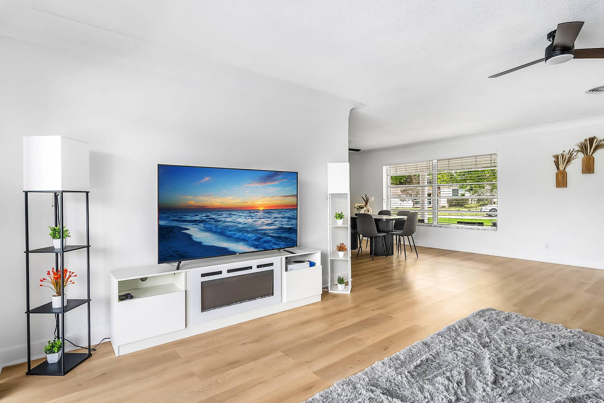 1250 SE 10TH Street, Deerfield Beach, Deerfield Beach, FL 33441 Bright interior featuring wood-finish flooring, white walls, and a contemporary ceiling fan
