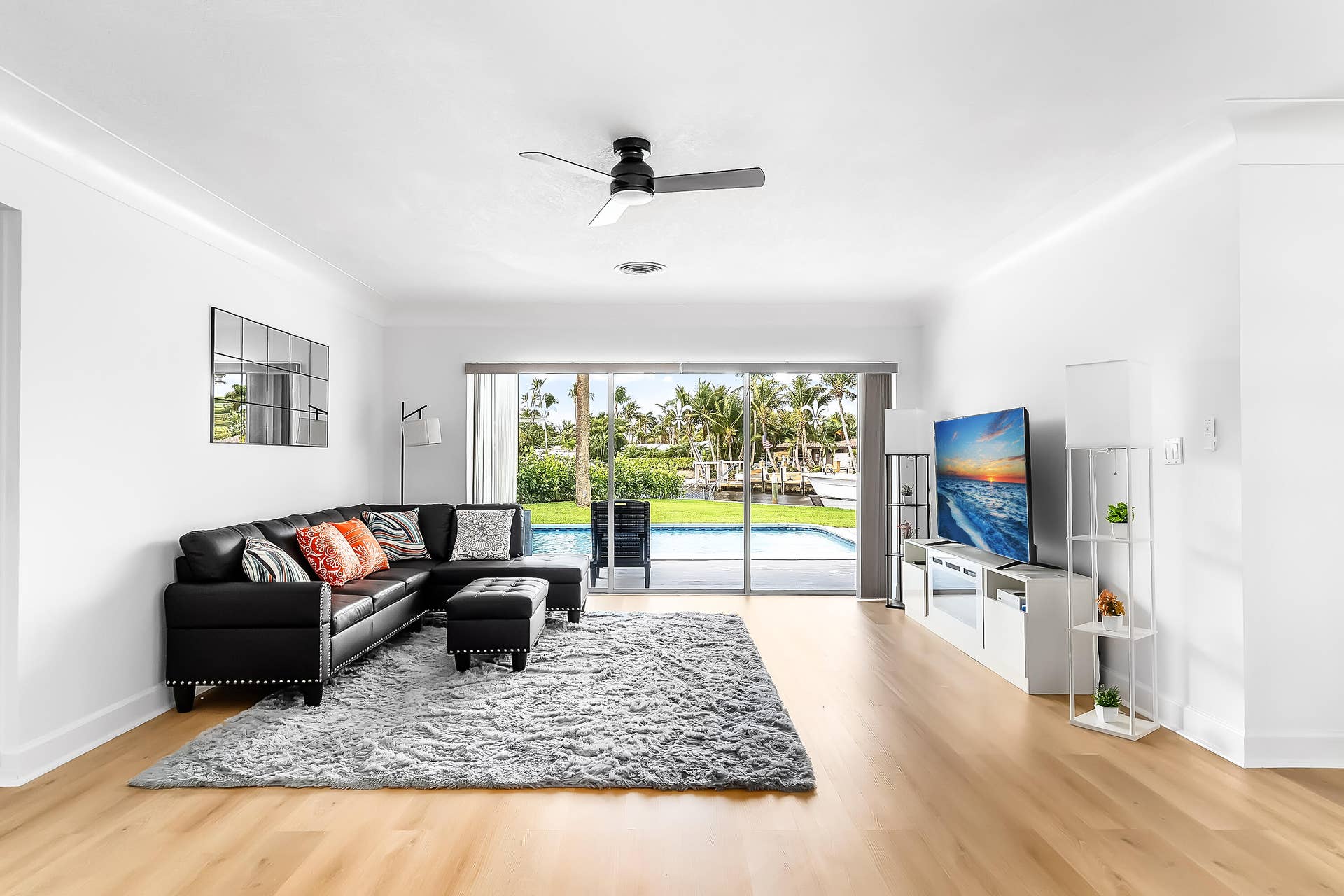 1250 SE 10TH Street, Deerfield Beach, Deerfield Beach, FL 33441 Bright interior space featuring wood-finish flooring, a contemporary ceiling fan, and recessed lighting