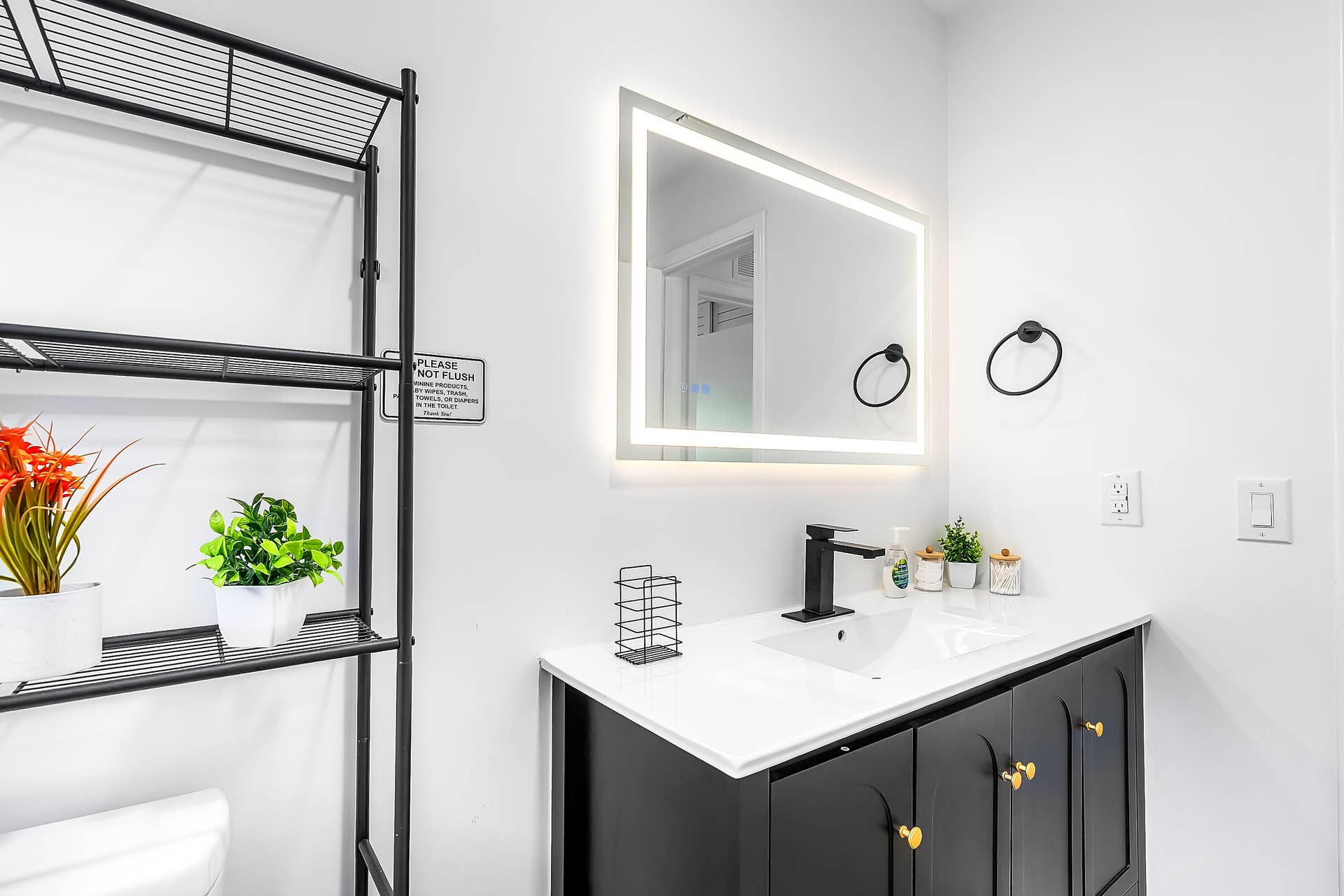 1250 SE 10TH Street, Deerfield Beach, Deerfield Beach, FL 33441 Modern bathroom vanity featuring a white countertop, undermount sink, and matte black faucet