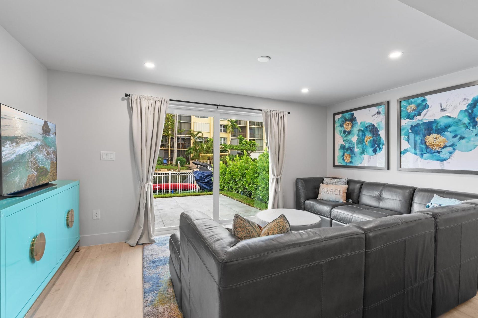 Recessed ceiling lighting, light wood-finish flooring, and white walls