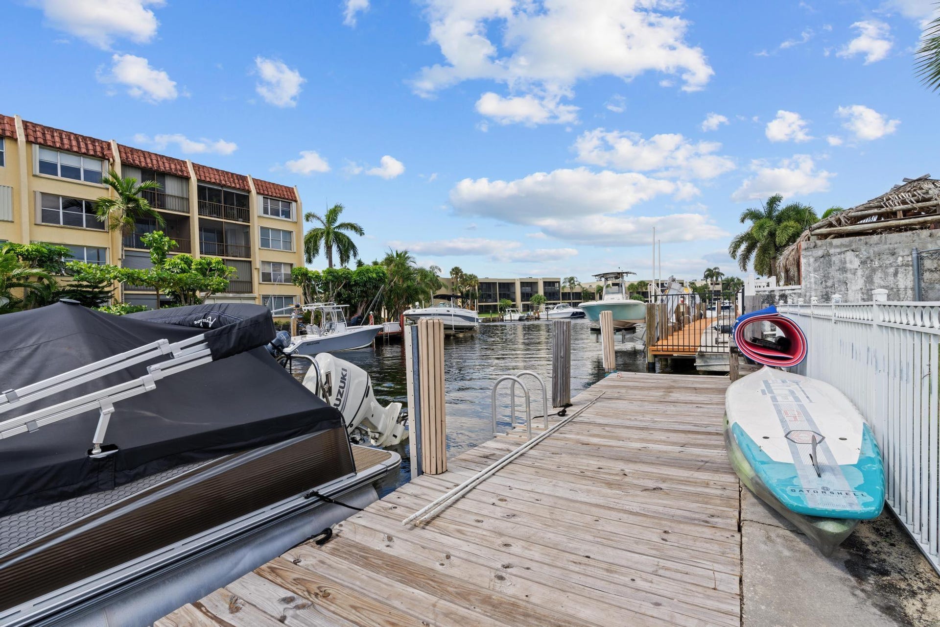 Waterfront property with an available private wooden dock, fits a 38ft boat slip, and direct canal access