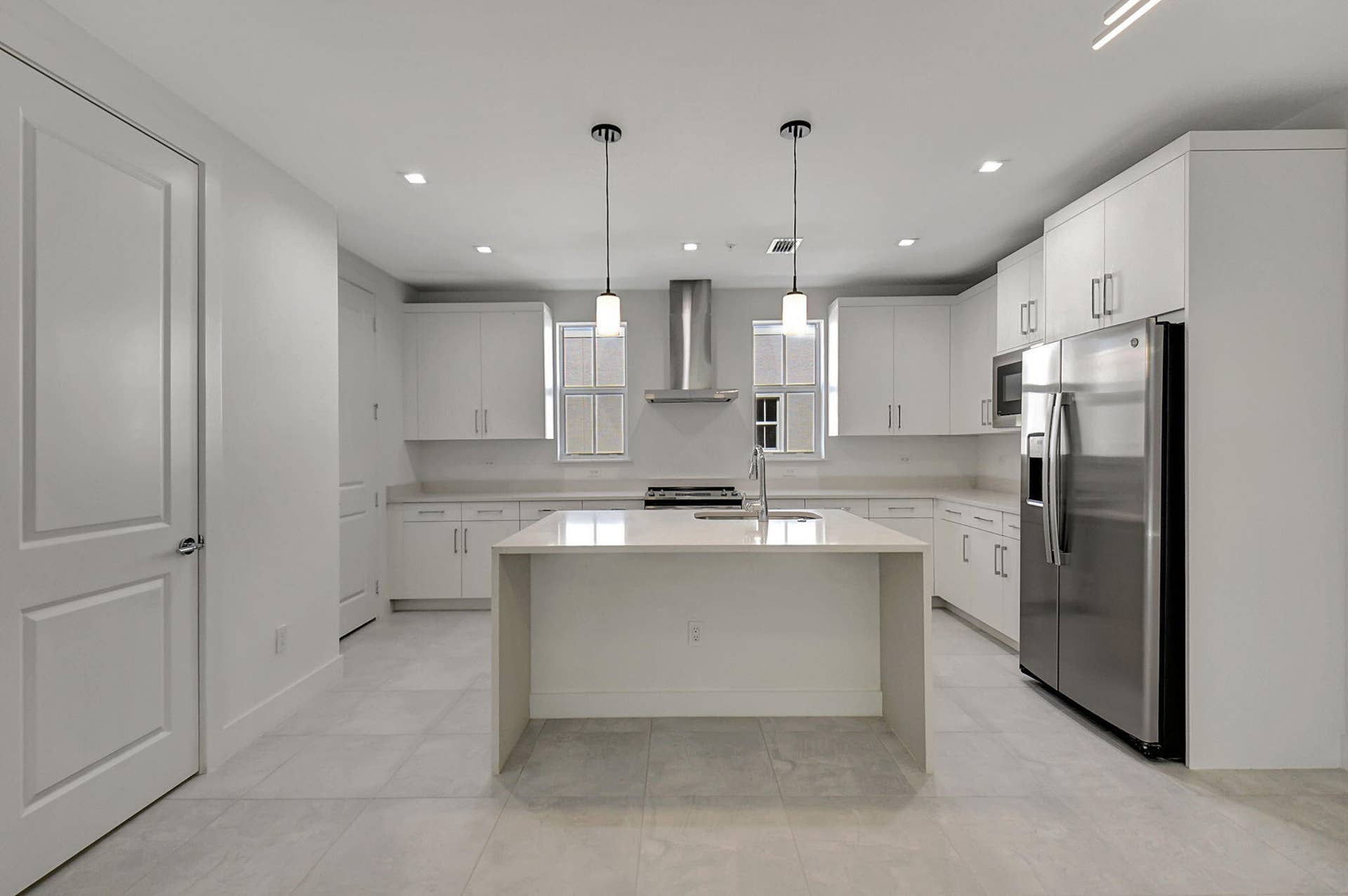 54 Atlantic Grove Way, Delray Beach, FL 33444 all stainless appliances, guest bath off living/dining area