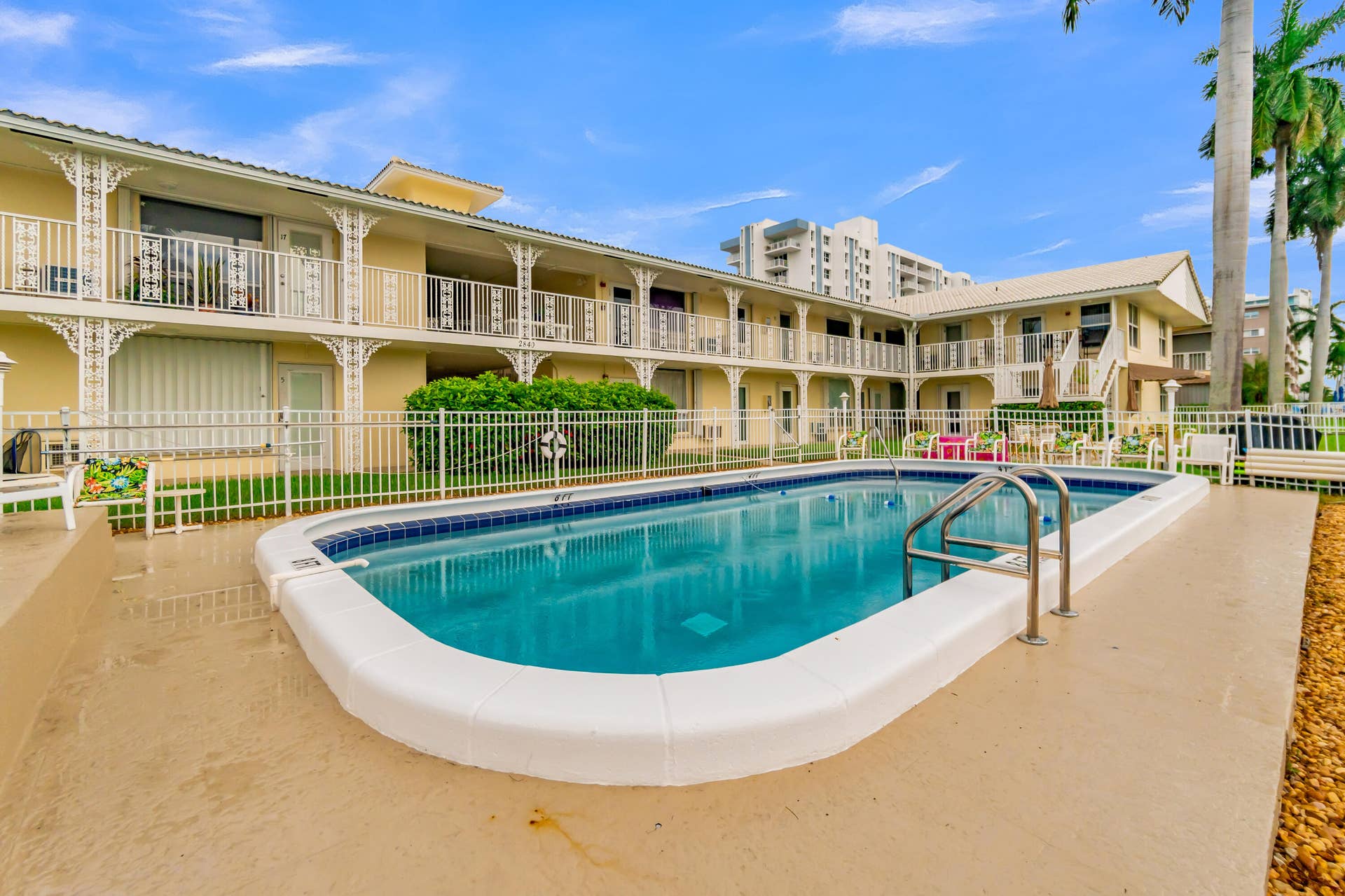 2840 NE 33RD Court, #2, Fort Lauderdale, FL 33306 Rectangular swimming pool with integrated steps and a surrounding concrete deck