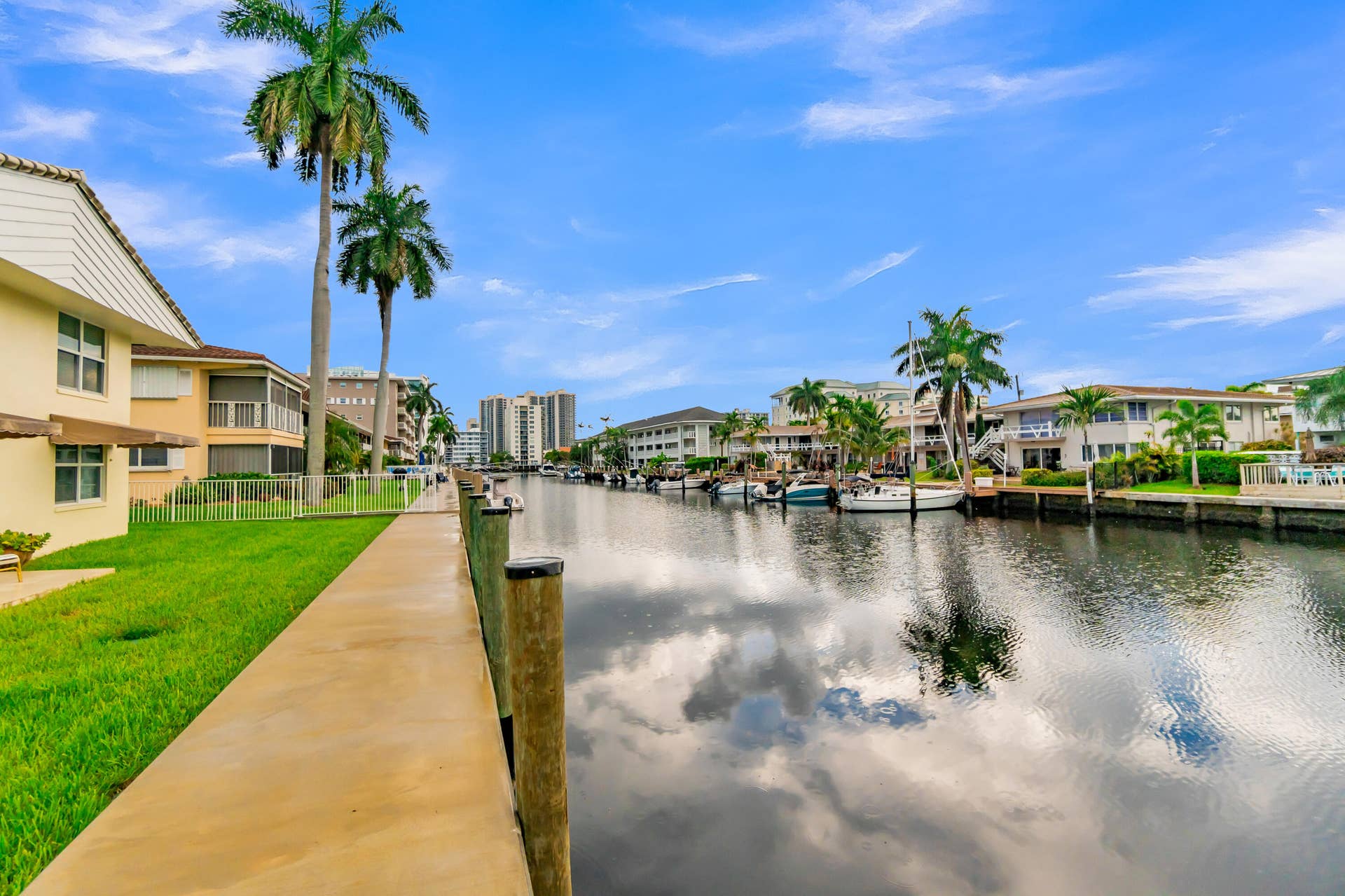 2840 NE 33RD Court, #2, Fort Lauderdale, FL 33306 Waterfront property with a private dock and mature palm trees