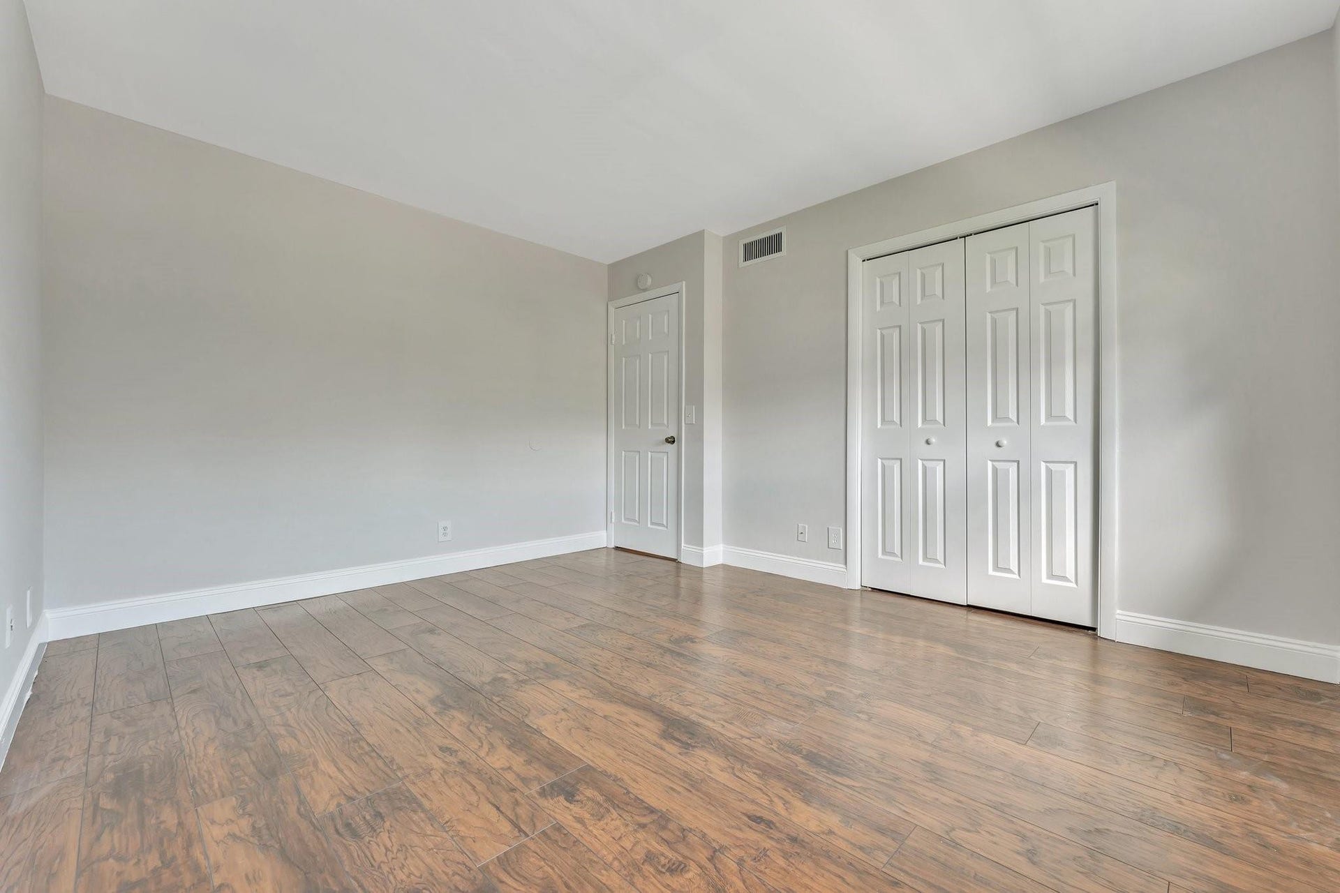 2nd spacious bedroom, shown vacant.