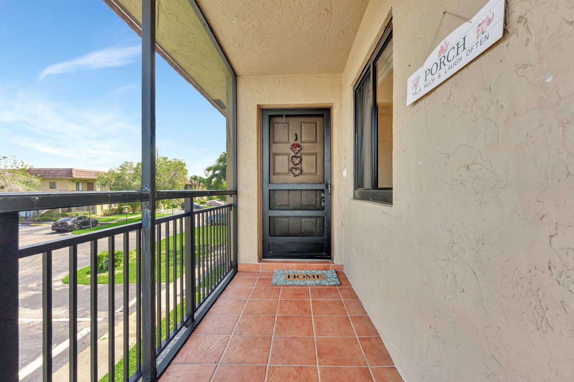 Long screen-in tiled entry way