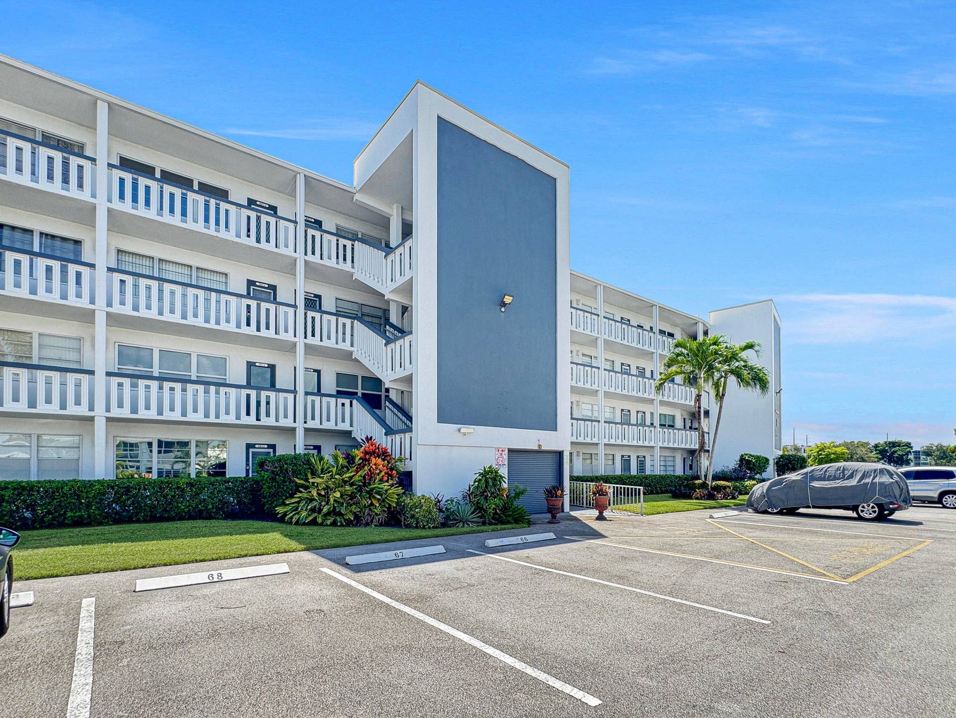 1013 HARWOOD C, #1013, Deerfield Beach, FL 33442 Multi-story residential building with private balconies and exterior stairwells