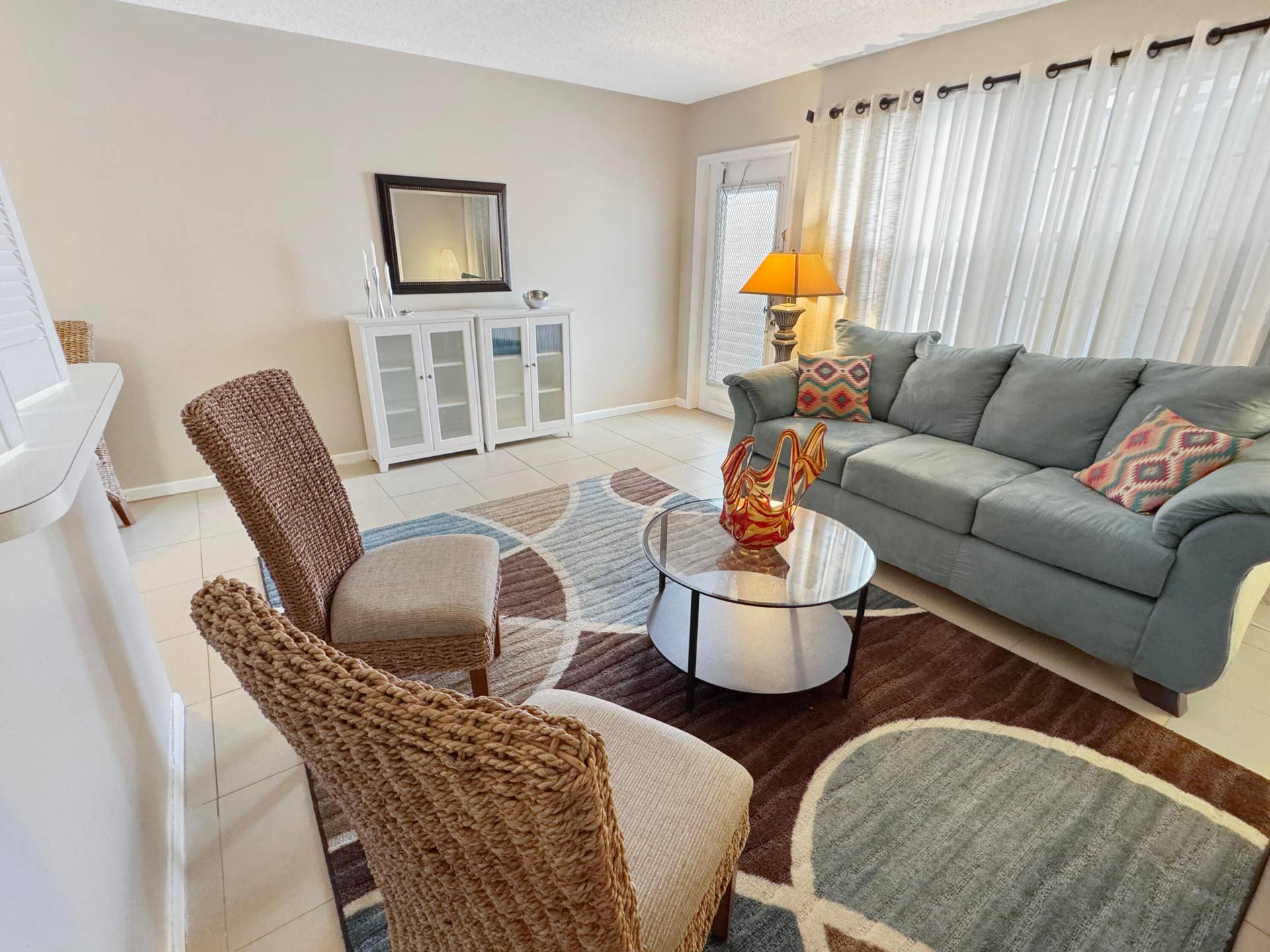 1013 HARWOOD C, #1013, Deerfield Beach, FL 33442 Light-toned walls complement the tile flooring throughout the space