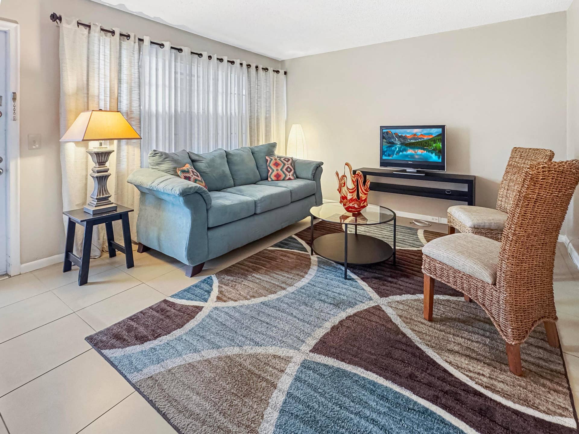 1013 HARWOOD C, #1013, Deerfield Beach, FL 33442 Light-toned wall paint, neutral floor tile, and a prominent window with sheer and blackout curtains