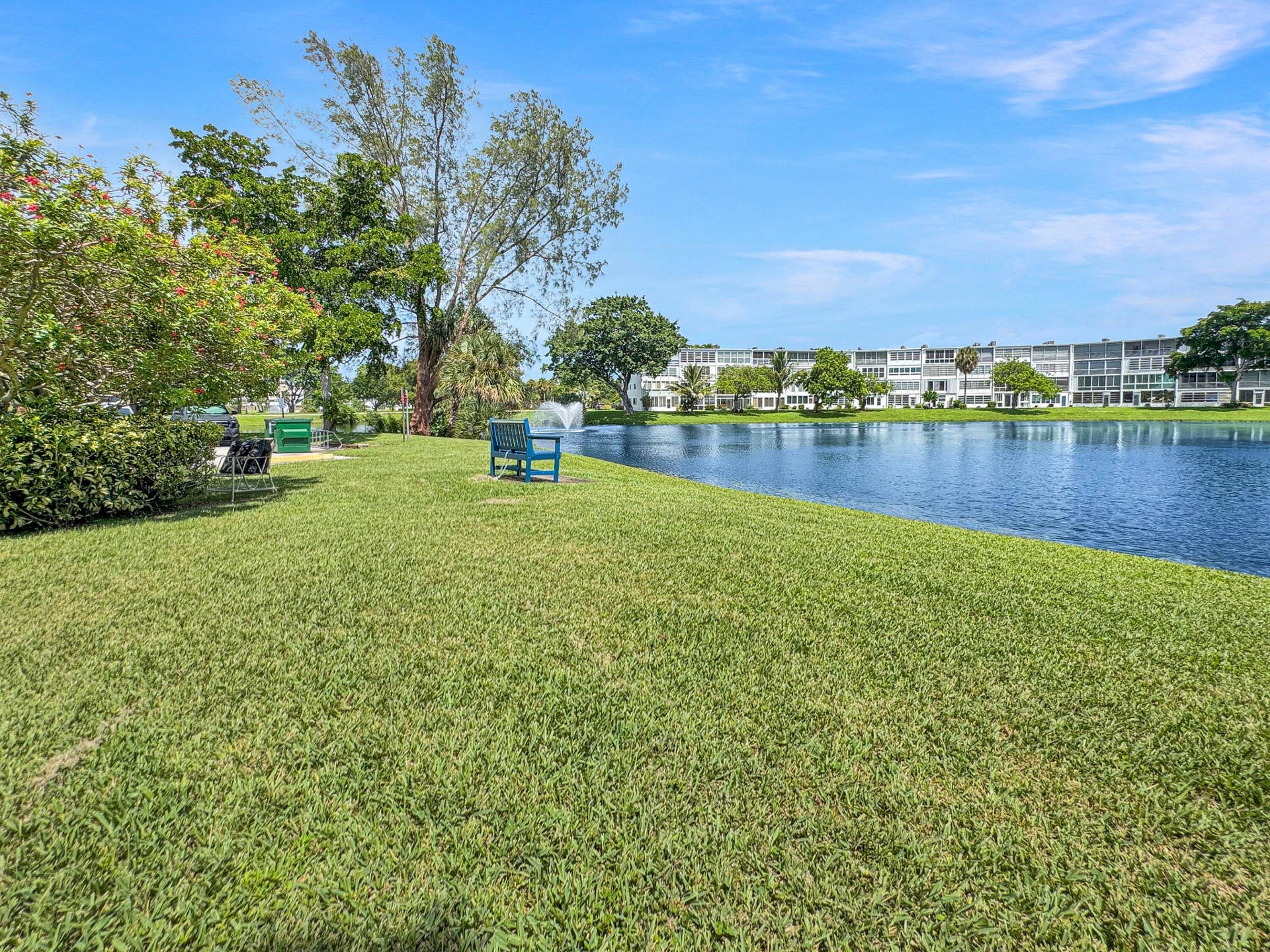 1013 HARWOOD C, #1013, Deerfield Beach, FL 33442 Expansive green space featuring a large body of water, mature trees, and landscaping
