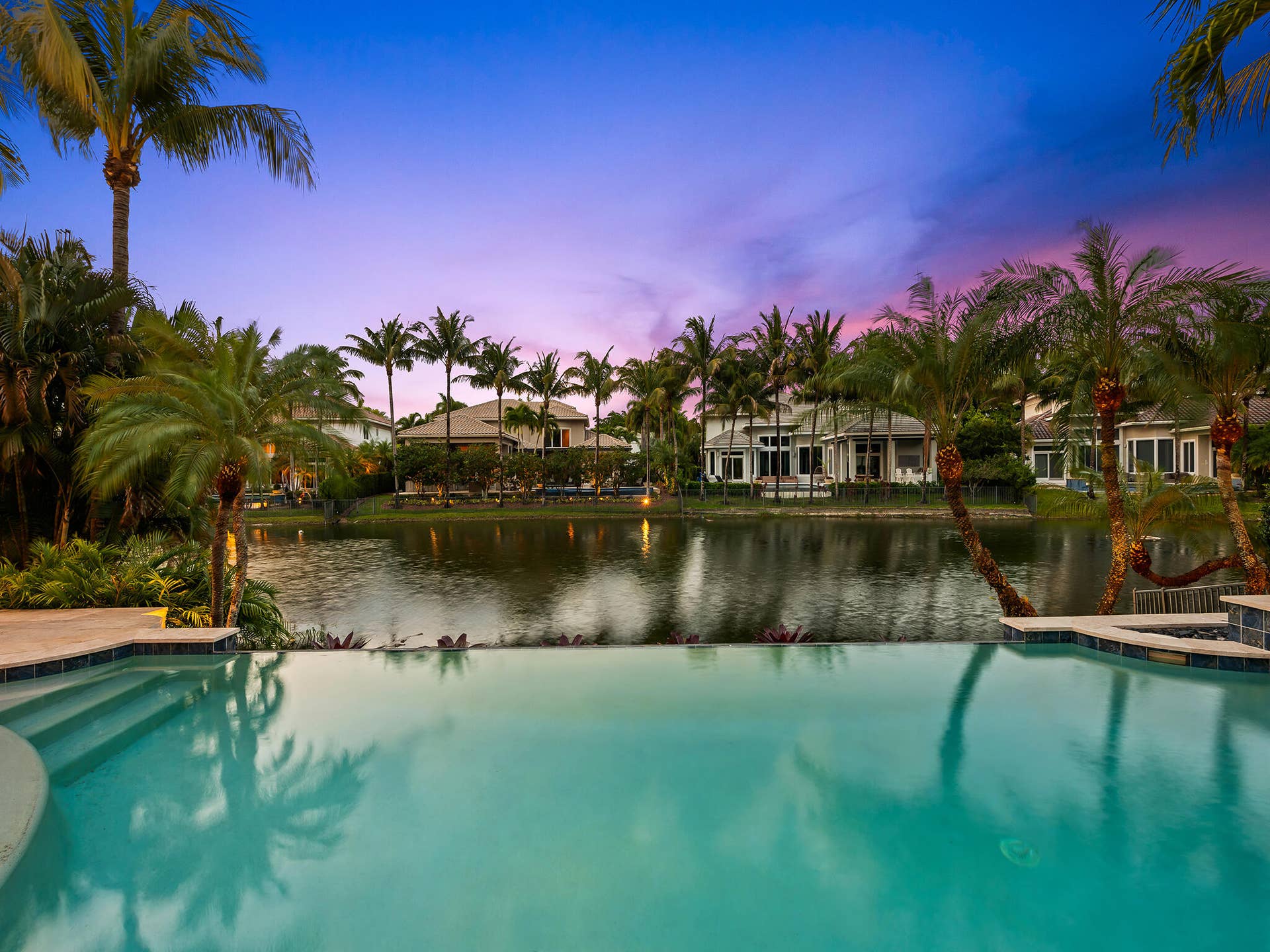 10241 KEY PLUM Street, Plantation, FL 33324 Water View at Twilight of Vanishing Edge Heated Pool and Spa