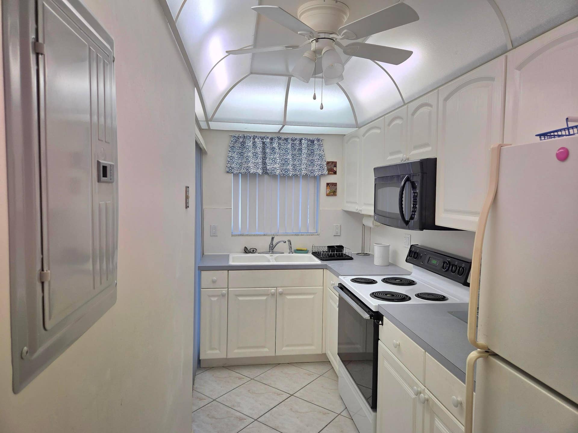 2100 NE 38TH Street, #110, Lighthouse Point, FL 33064 Access to the Lanai from the Kitchen