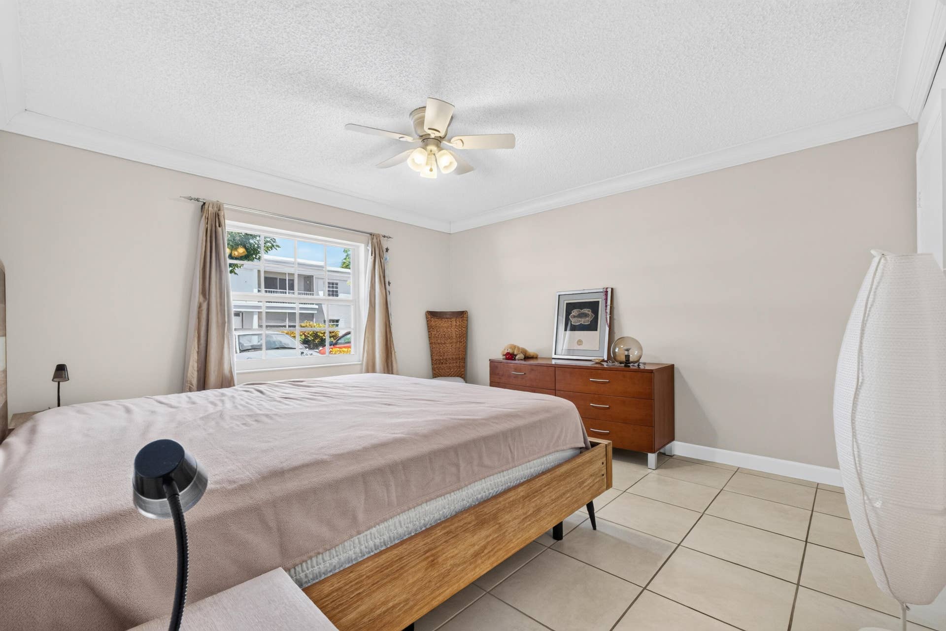 6359 Bay Club Drive, #2, Fort Lauderdale, FL 33308 Recessed window with white trim, ceiling fan, crown molding, and tiled flooring