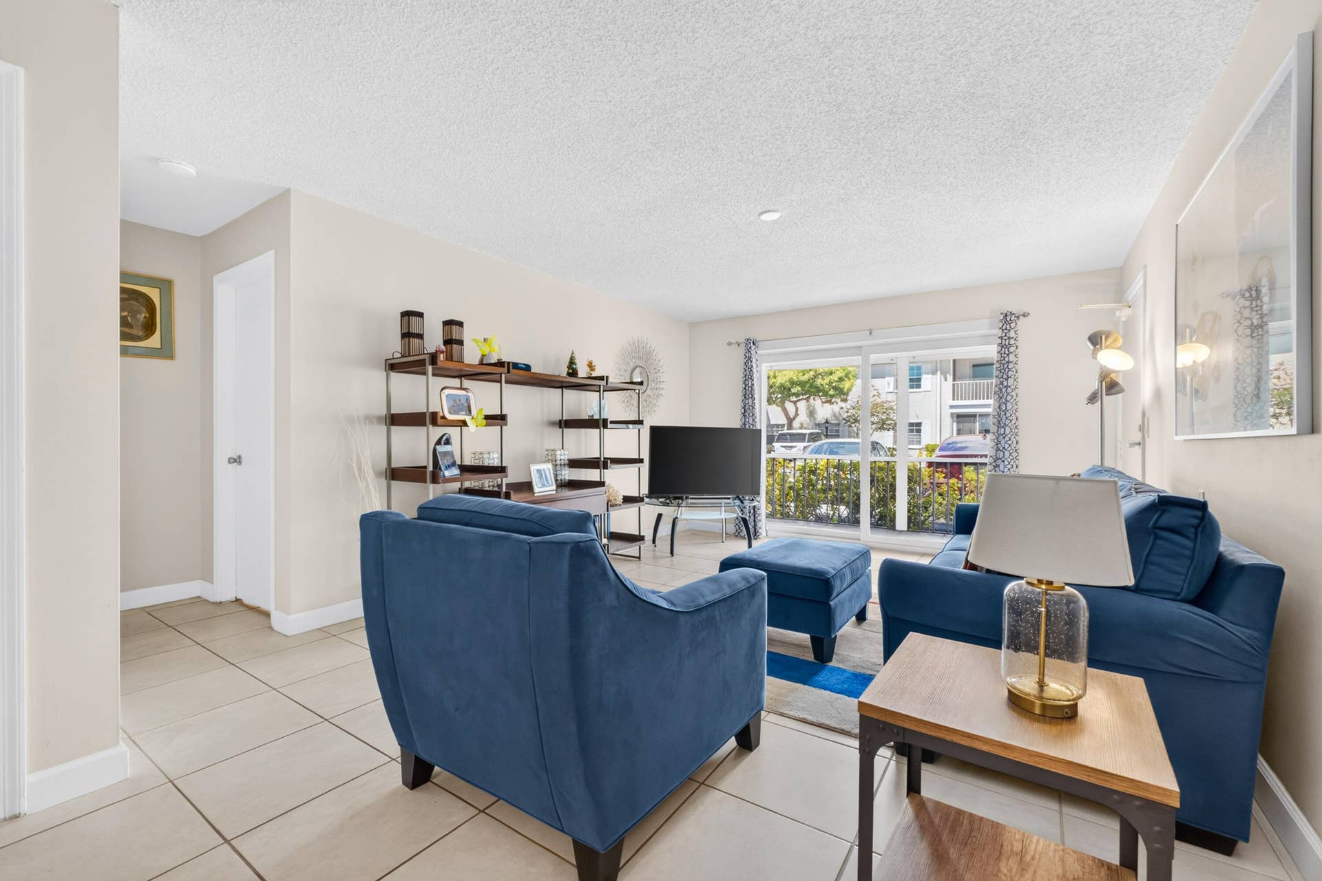 6359 Bay Club Drive, #2, Fort Lauderdale, FL 33308 Bright and spacious living area featuring tile flooring, recessed lighting, and large windows with plantation shutters