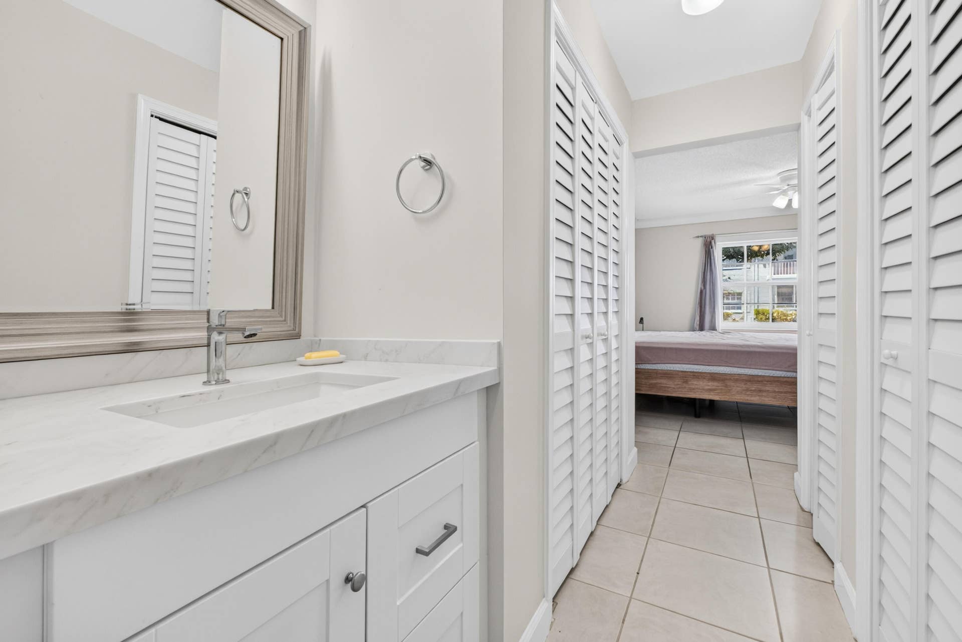 6359 Bay Club Drive, #2, Fort Lauderdale, FL 33308 White vanity with an integrated rectangular sink and polished chrome faucet